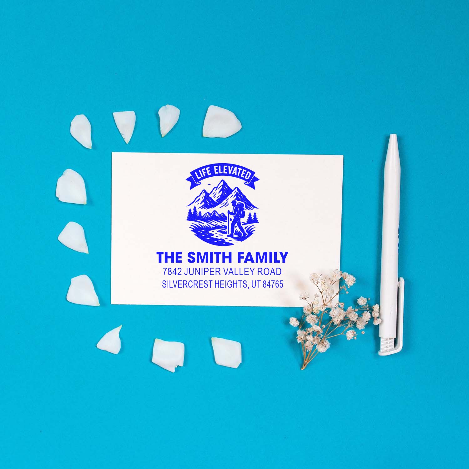 Custom family address rubber stamp with mountain hiking logo, The Smith Family name, and return address.