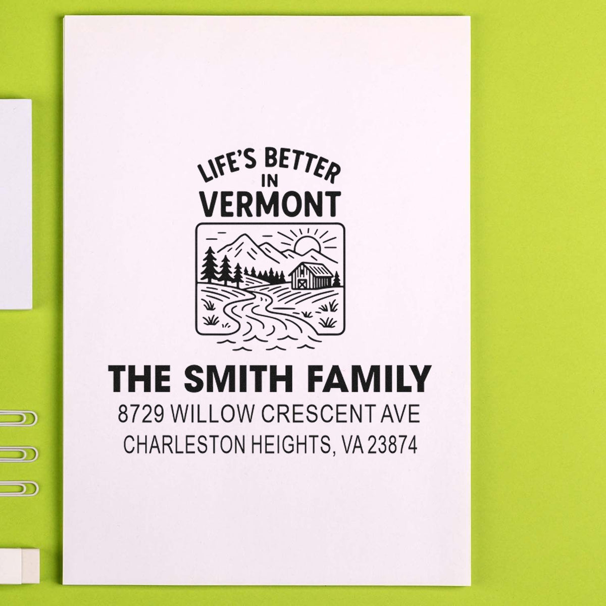 Custom return address rubber stamp with Vermont landscape design and The Smith Family mailing address.