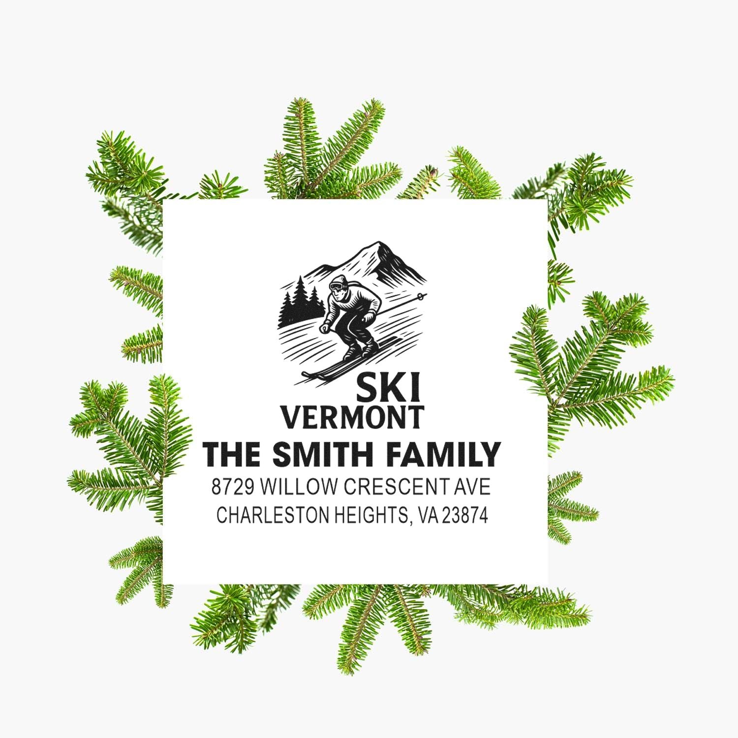 Custom Vermont ski return address stamp with skier, mountain and pine design, framed by evergreen branches.