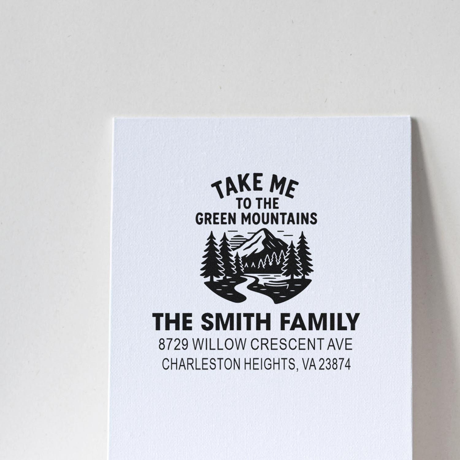 Custom address stamp for The Smith Family with Take Me to the Green Mountains text, pine trees, mountain graphic, and Charleston Heights, VA address.