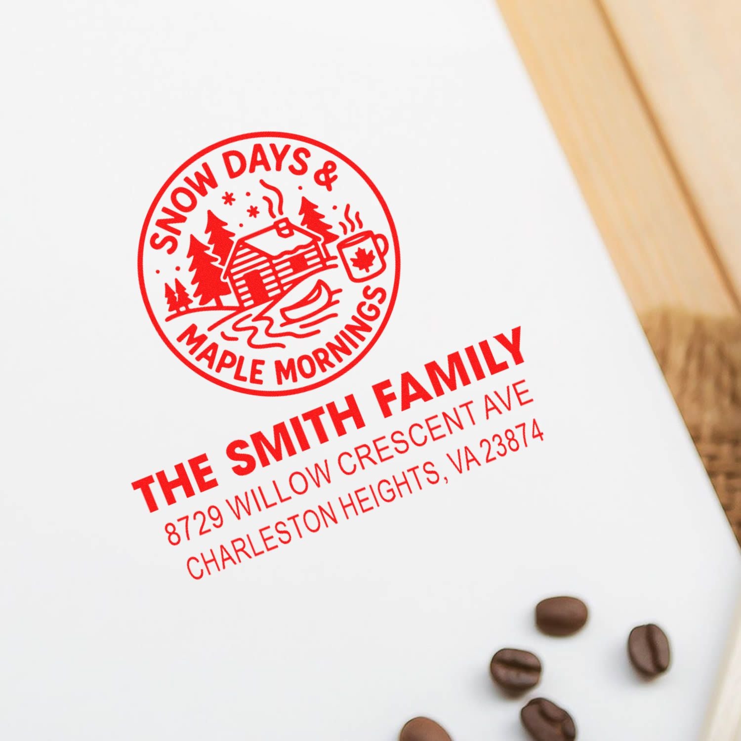 Custom rubber stamp impression with Snow Days & Maple Mornings cabin design and Smith family return address on stationery.