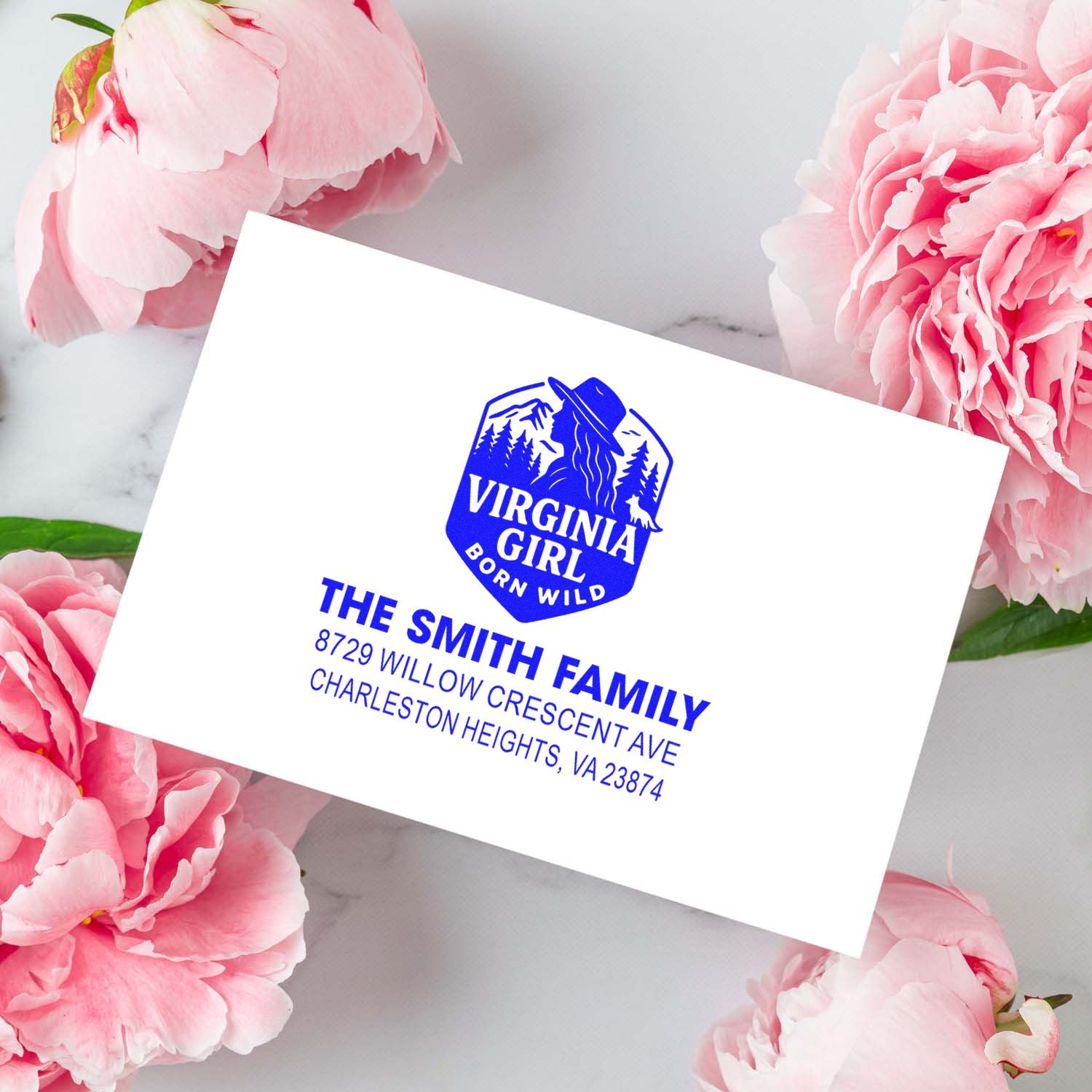 Custom Virginia Girl return address stamp for The Smith Family, with blue address text on a pink peony background.