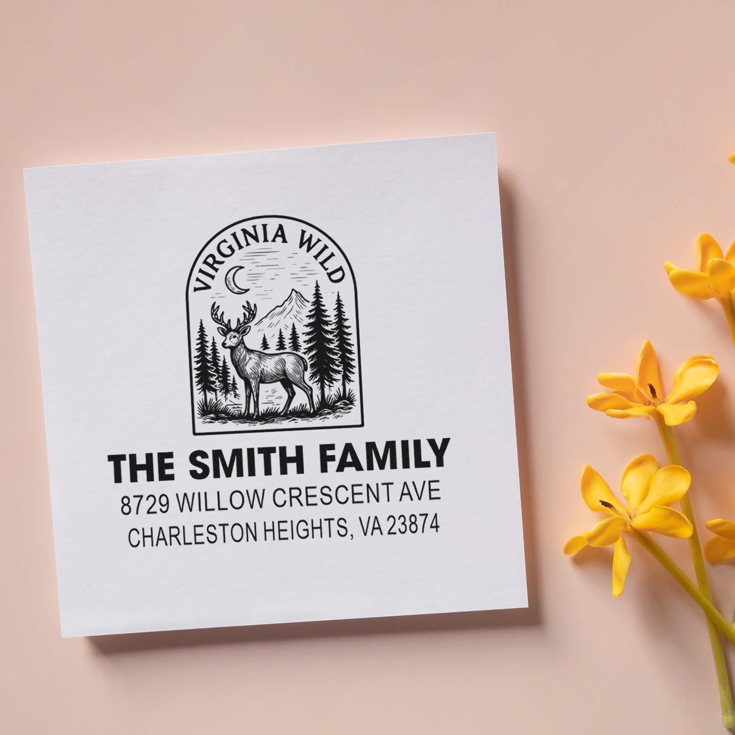 Custom Virginia Wild return address stamp for The Smith Family with deer, mountains and pine trees on white card, styled with yellow flowers.