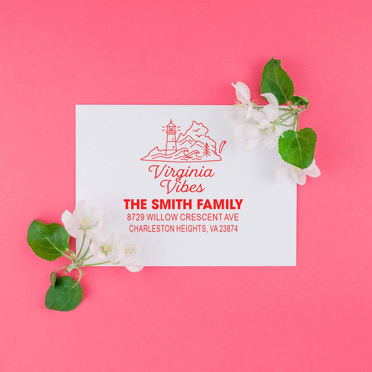 Custom Virginia Vibes family address stamp with lighthouse design, displayed on white paper over a pink background with cherry blossoms and green leaves.