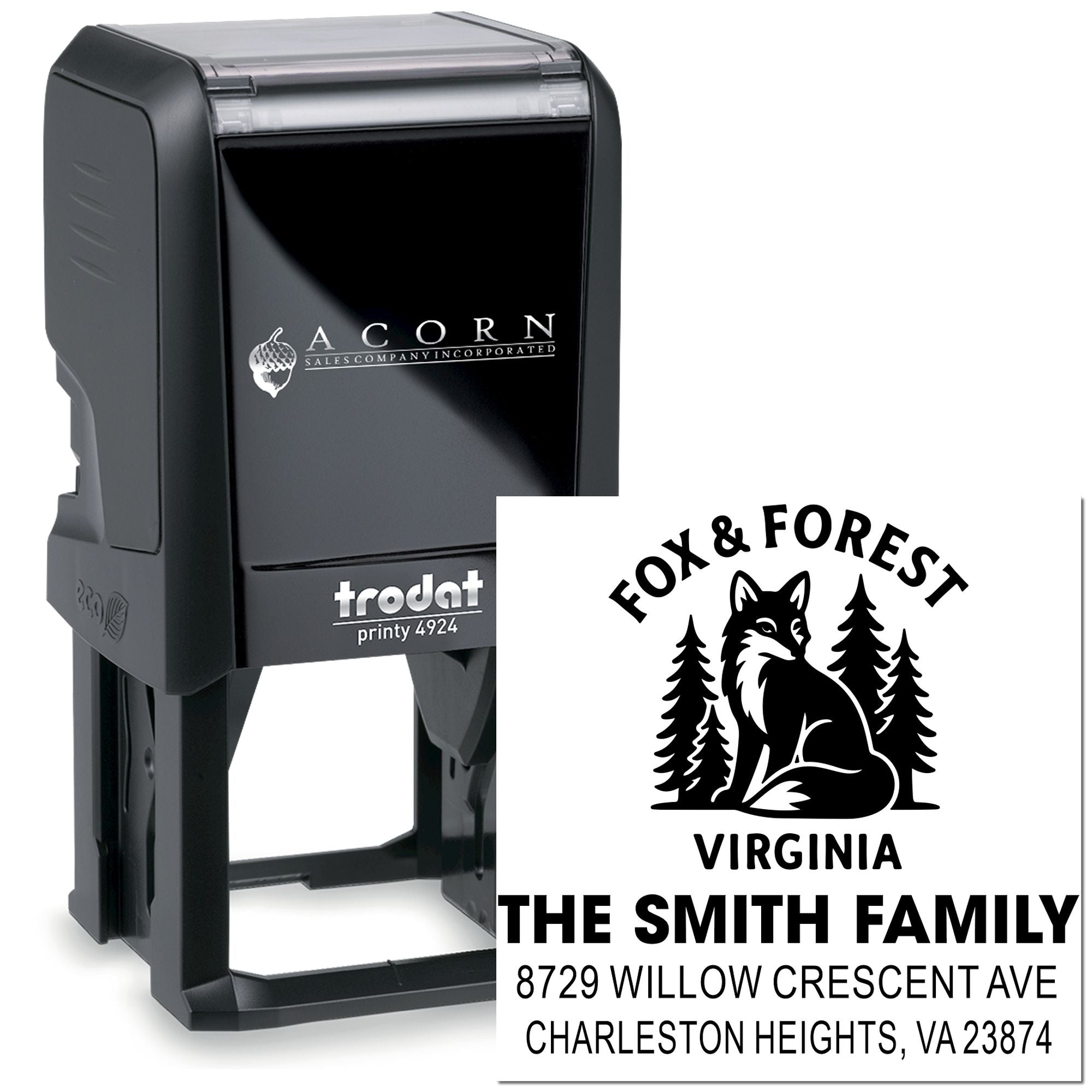 Custom self-inking Trodat address stamp with fox and forest design, Virginia family name and address, shown beside black stamp holder on white background.