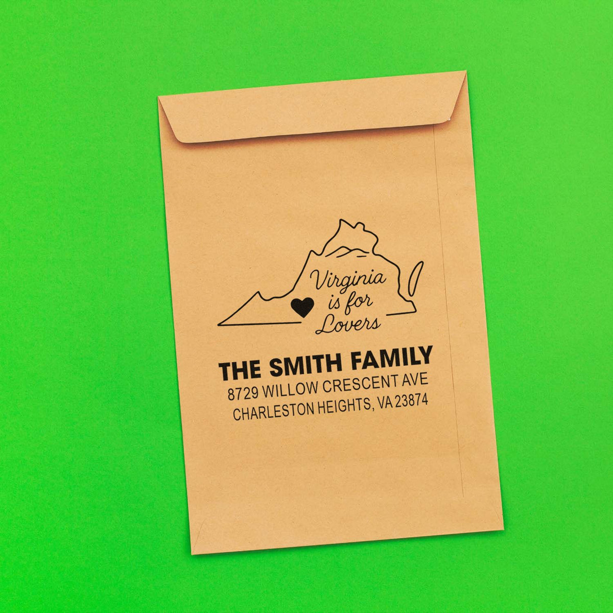 Custom Virginia is for Lovers return address stamp on a kraft envelope, with The Smith Family address on a bright green background.