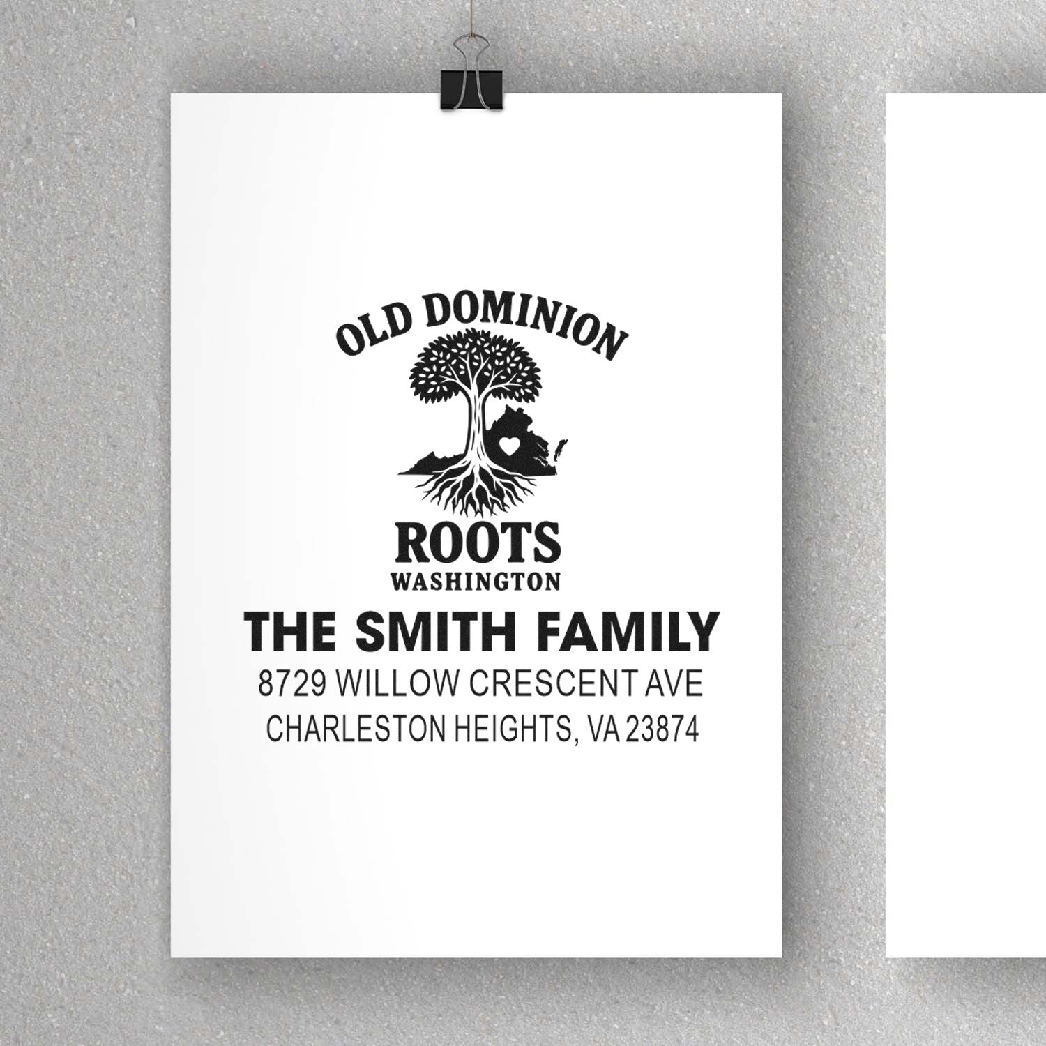 Custom stamp with Old Dominion Roots Washington tree design and The Smith Family address, displayed on white paper against a gray wall.