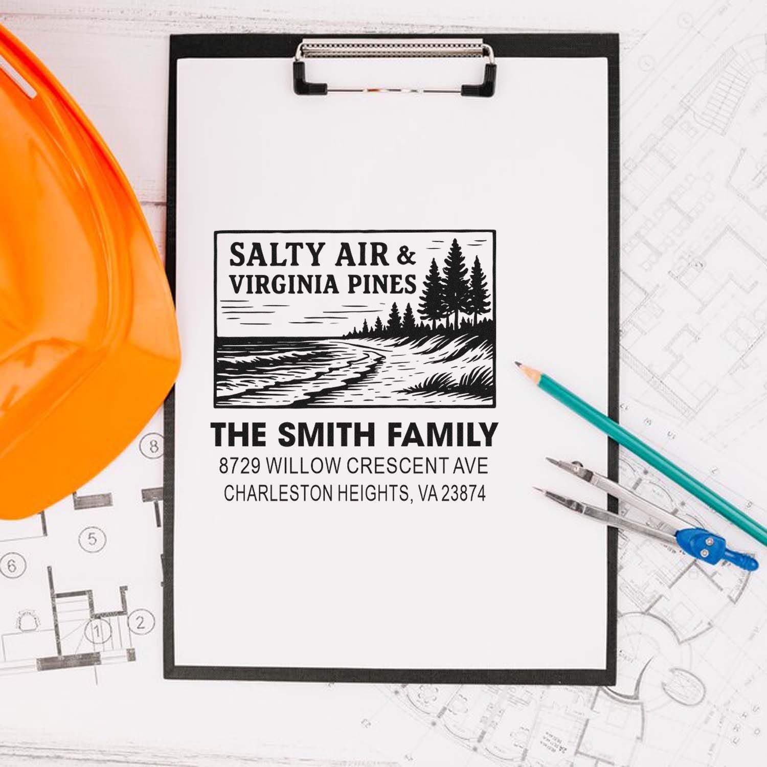 Custom family address stamp with Salty Air & Virginia Pines coastal design on a clipboard, surrounded by blueprint plans, hard hat, pencil, and compass.