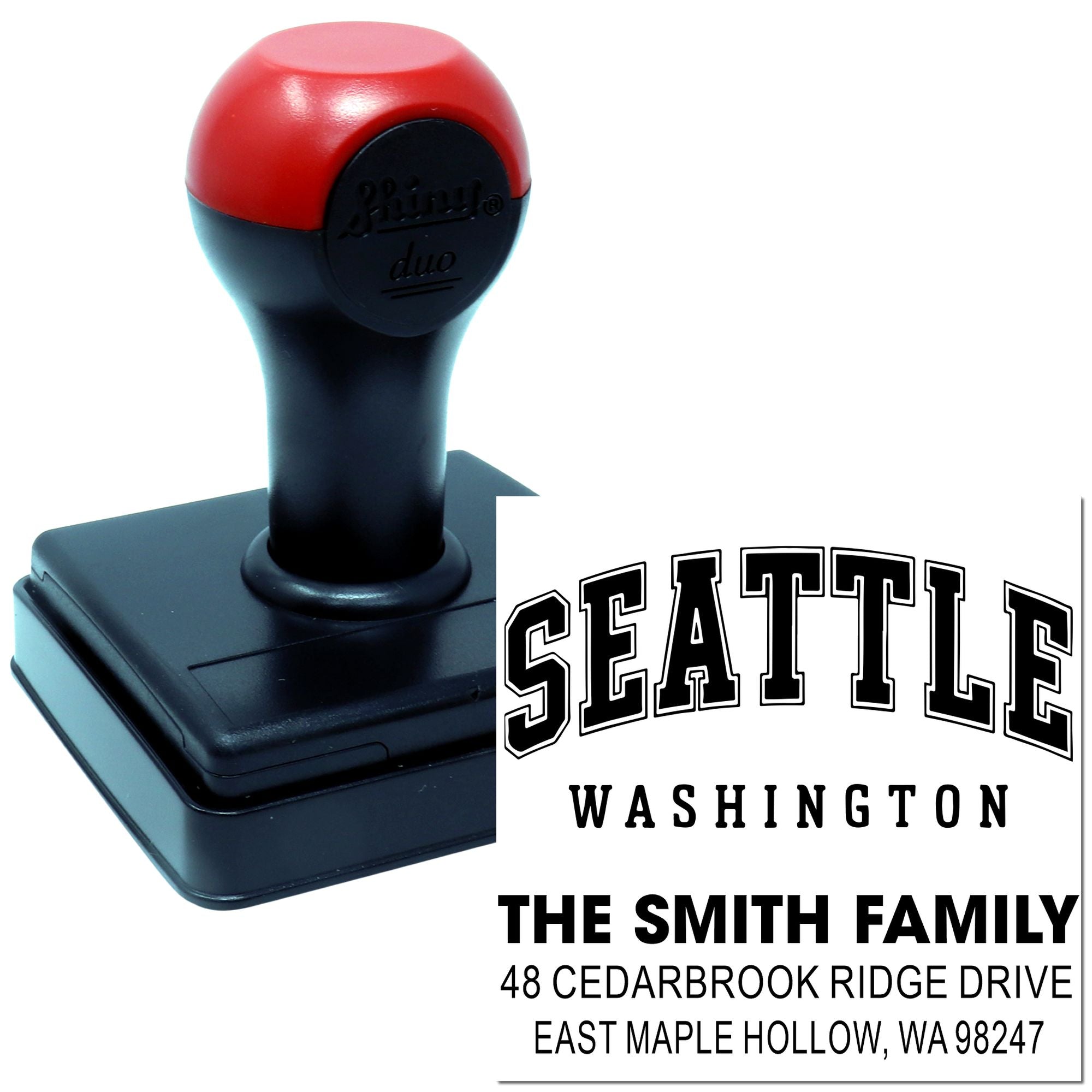 Custom self-inking address stamp with Seattle, Washington family address imprint on a white background.