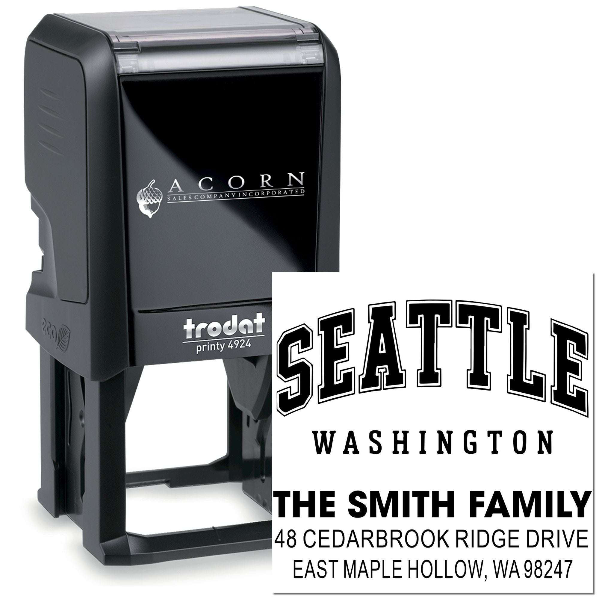 Custom self-inking address stamp with Seattle, Washington family name and mailing address, shown with Acorn Sales branding on a white background.