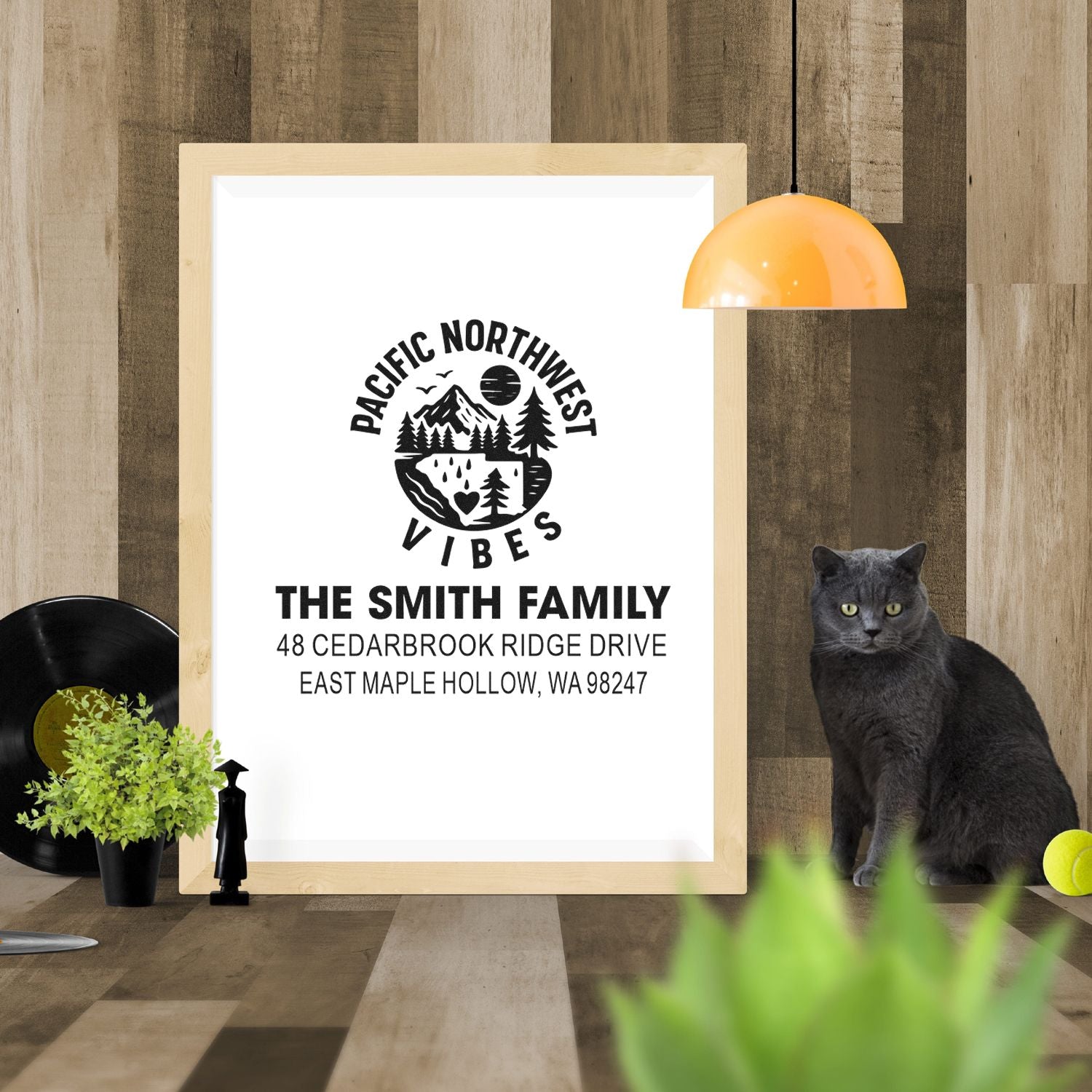 Custom Pacific Northwest Vibes return address stamp mockup in a wood frame, featuring The Smith Family name, address, cat, and home decor accents.