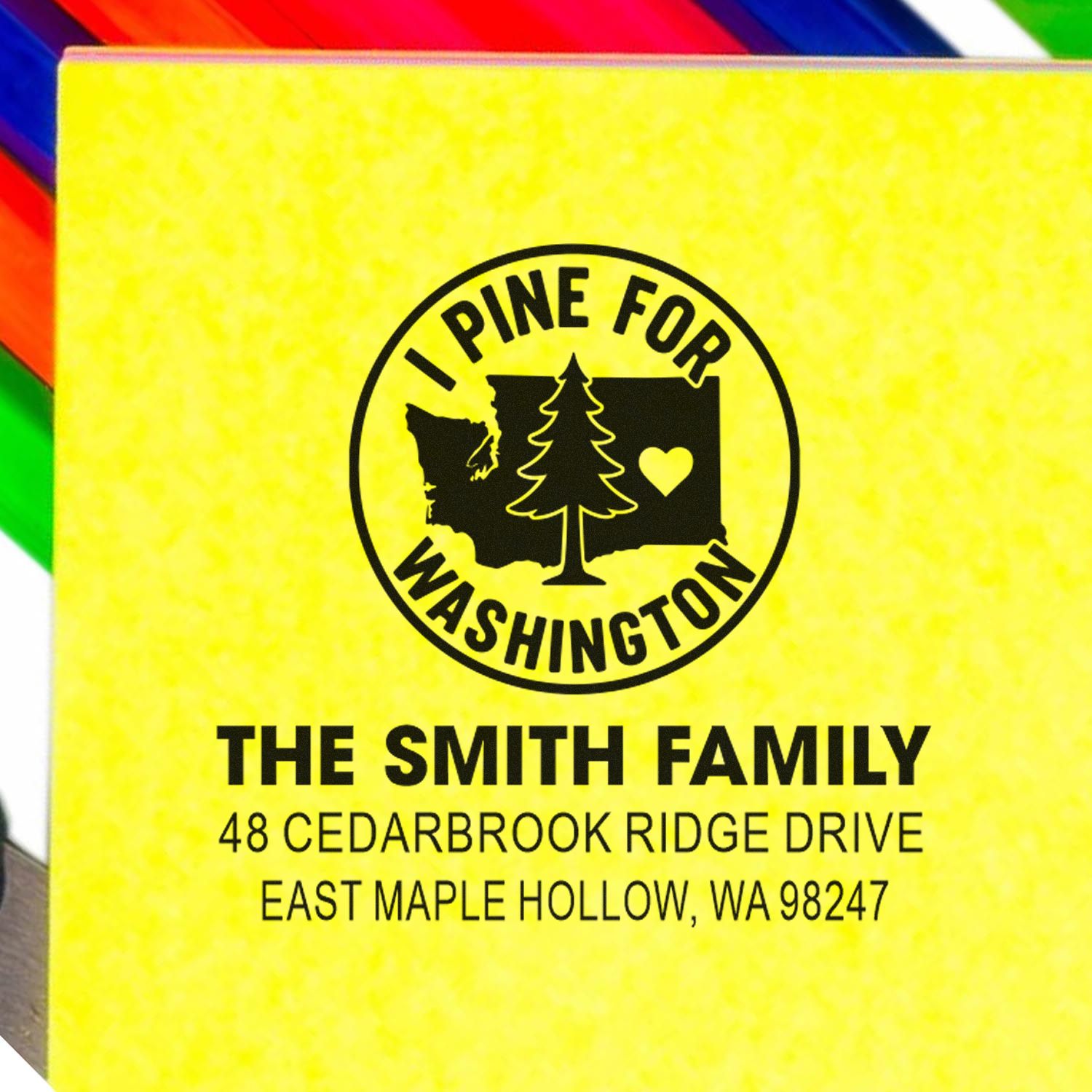 Custom address stamp for The Smith Family, featuring I Pine for Washington with Washington state, pine tree and heart on a yellow background.
