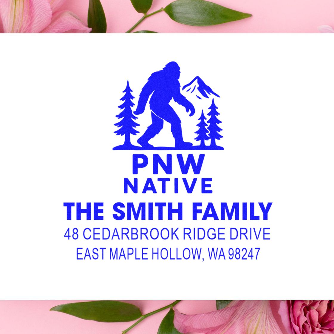 Blue PNW Native custom address stamp for The Smith Family, featuring Bigfoot, pine trees and mountain logo on a white floral background.