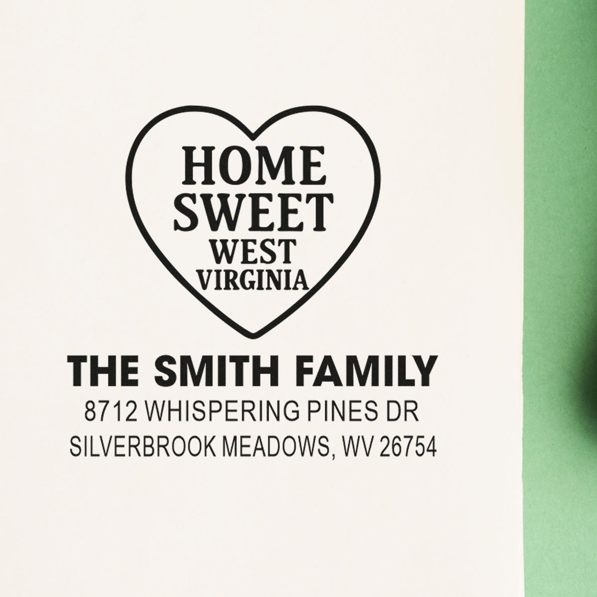 Custom heart-shaped Home Sweet West Virginia family address stamp for The Smith Family on white paper.
