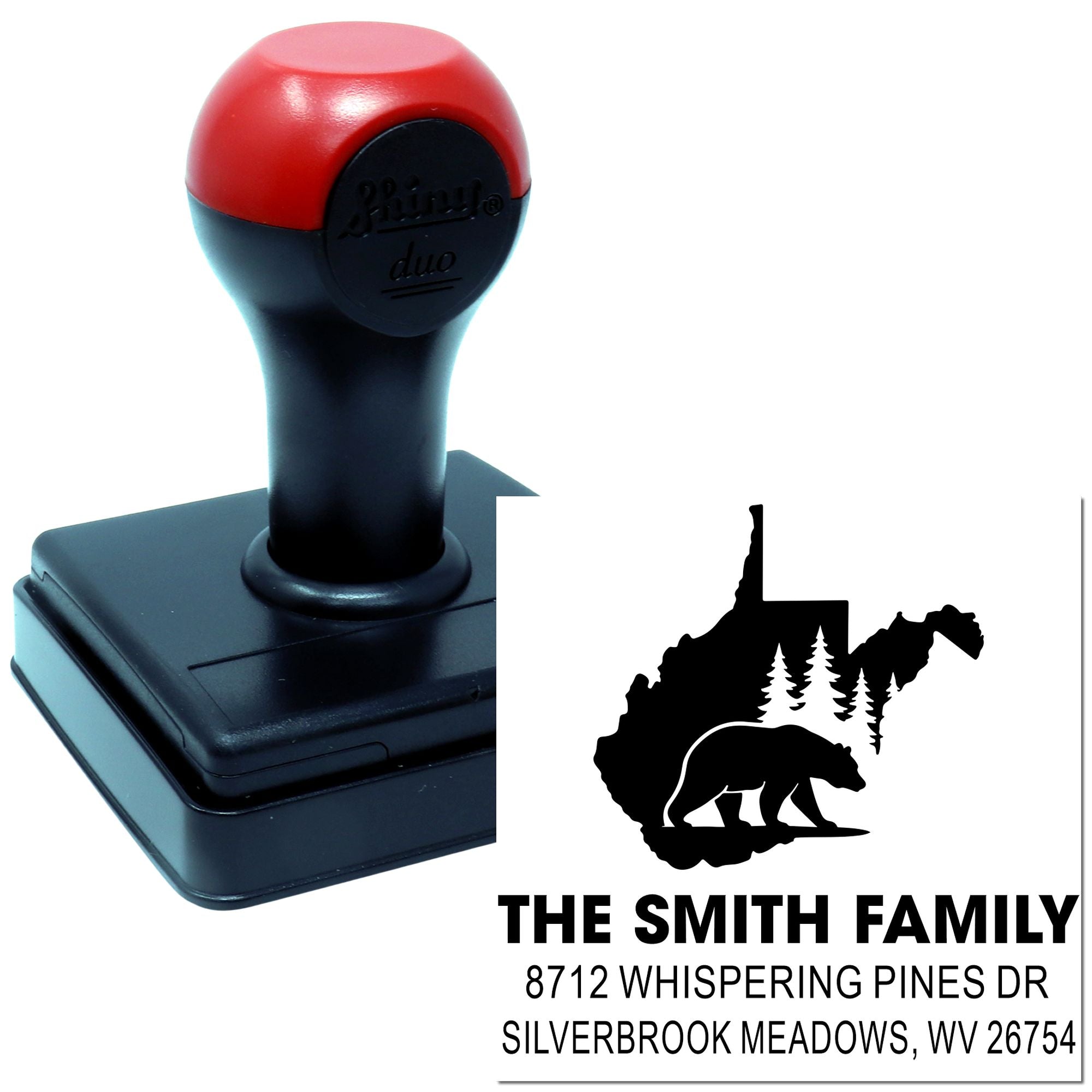 Custom self-inking address stamp with red and black handle, featuring a bear-and-pine family logo and The Smith Family address on a white background.
