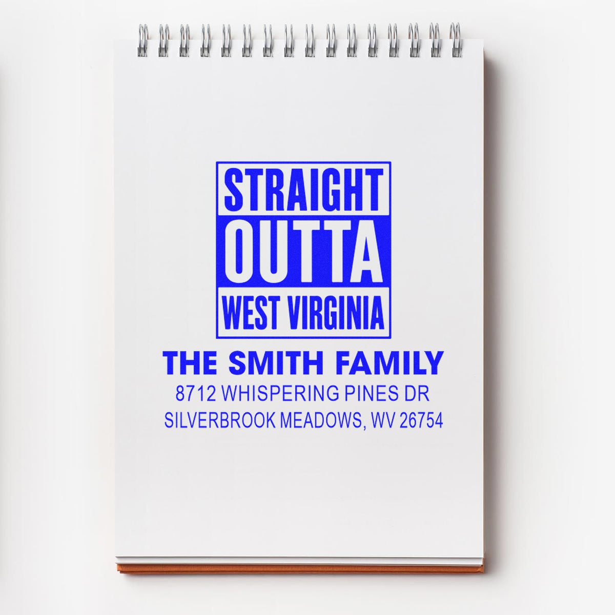 Custom address stamp on spiral notepad reading Straight Outta West Virginia for The Smith Family, Silverbrook Meadows, WV.