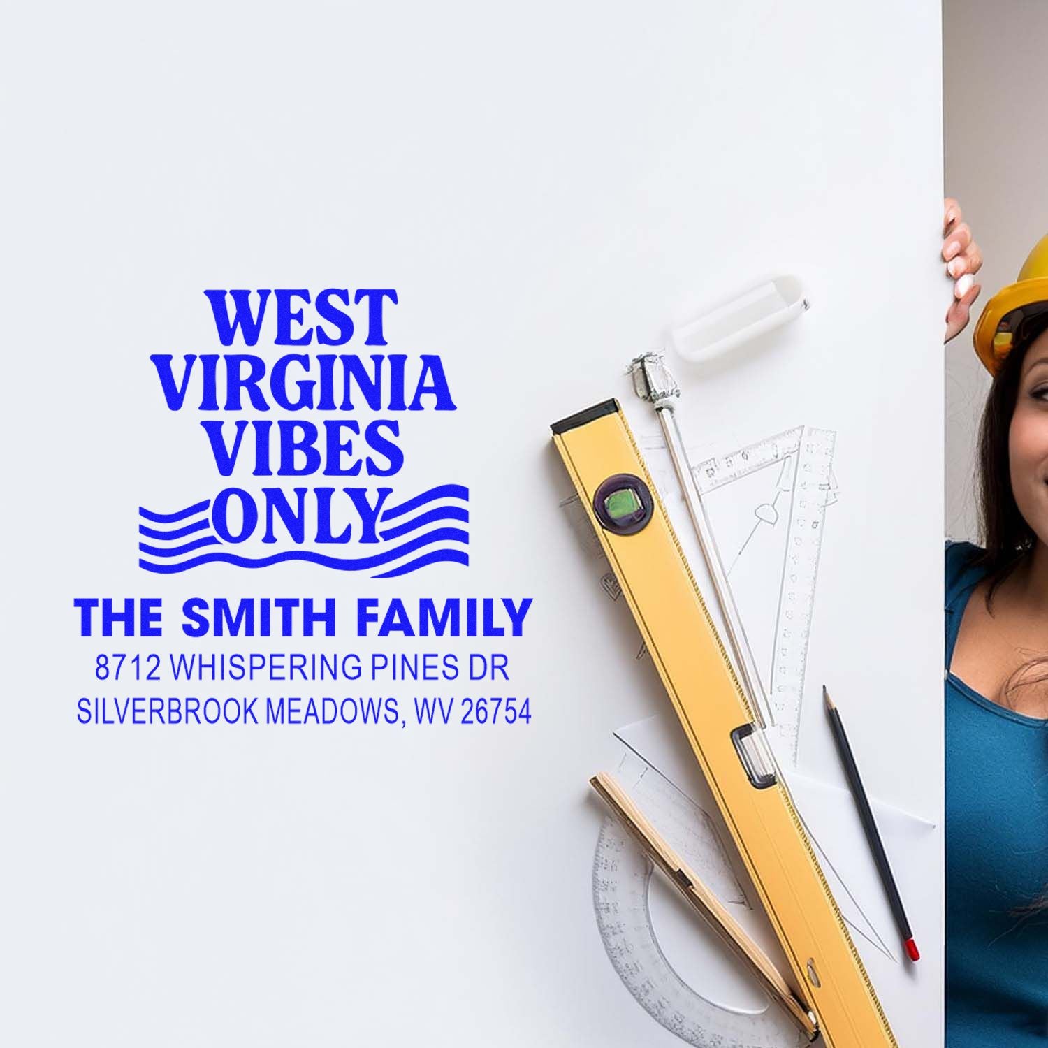 Custom West Virginia address stamp mockup with blue West Virginia Vibes Only imprint beside drafting tools and a woman in a hard hat.