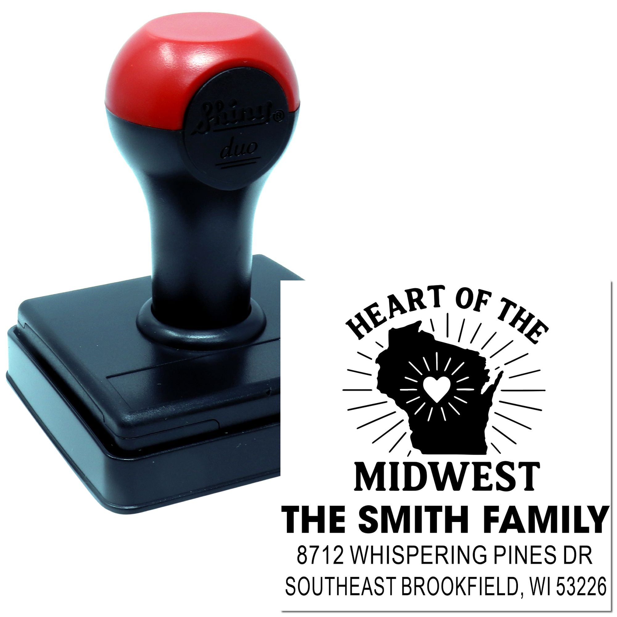 Custom self-inking stamp with red and black handle, showing Heart of the Midwest family address design on a white background.