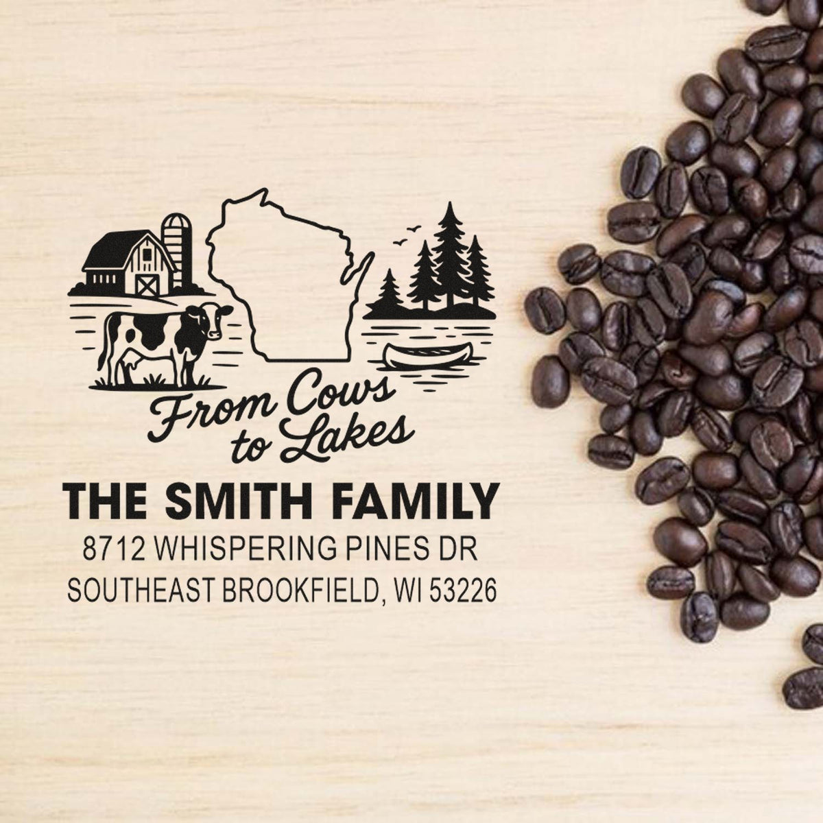 Personalized Wisconsin farm-and-lakes stamp with barn, cow, pine trees and canoe design beside coffee beans, featuring The Smith Family address.