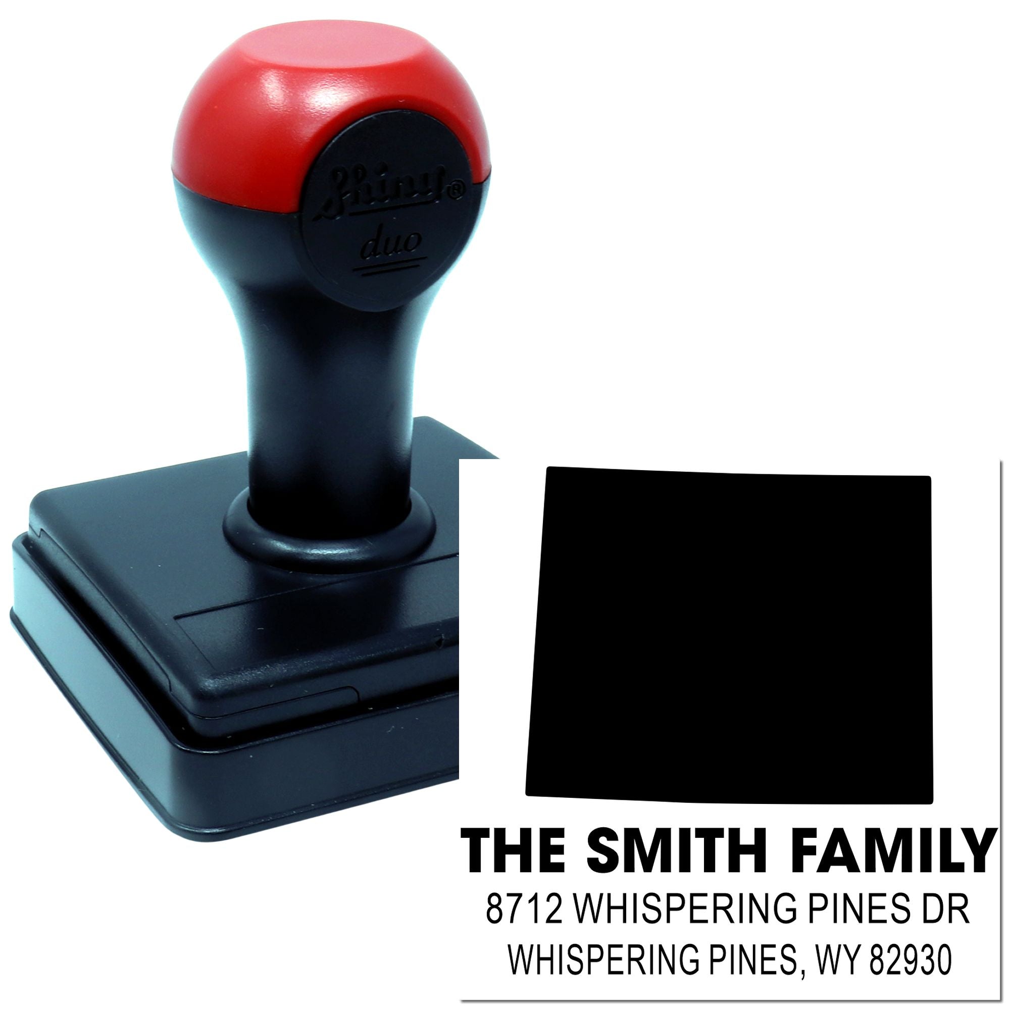 Custom self-inking address stamp with Smith Family name and Whispering Pines, WY address on white background.