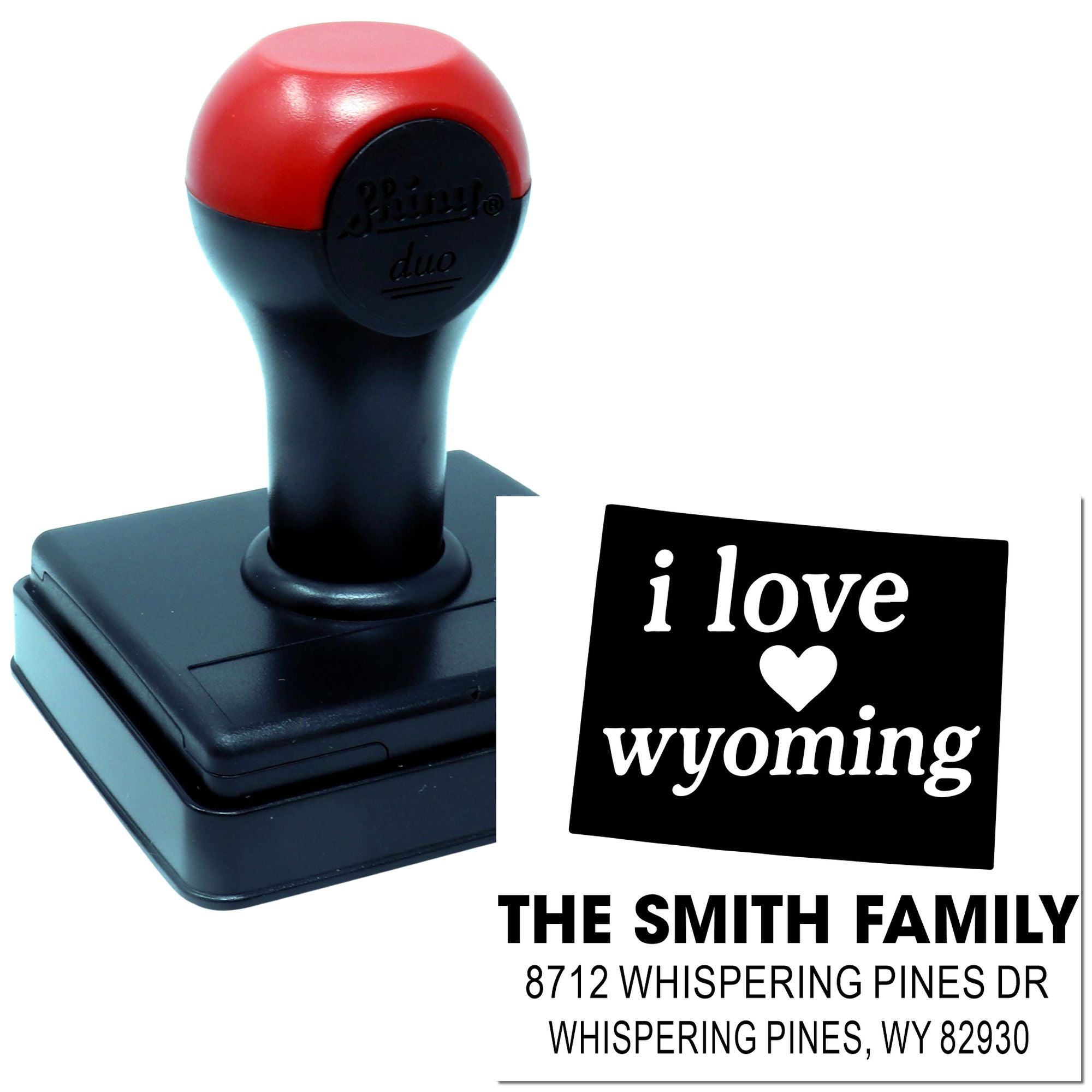 Custom self-inking address stamp with I love Wyoming design, heart icon, and The Smith Family Whispering Pines, WY address.