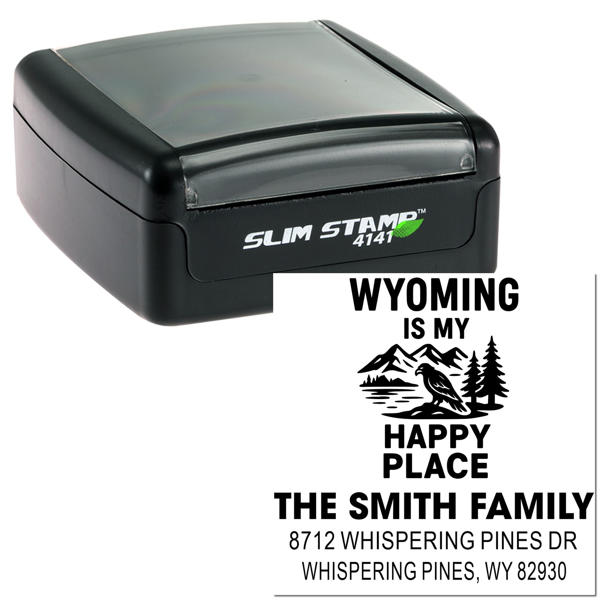 Black Slim Stamp self-inking custom address stamp featuring Wyoming Is My Happy Place design with mountains, bird, and family name on white background.