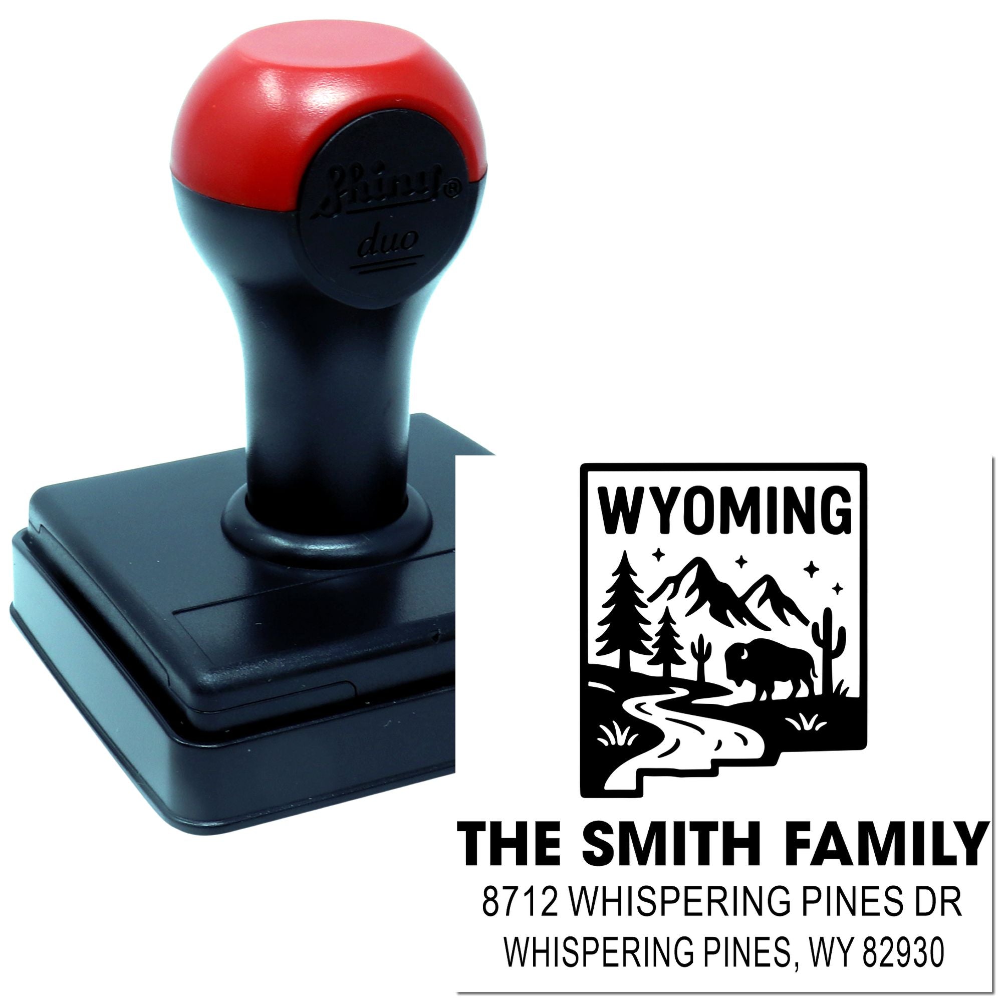 Custom Wyoming self-inking address stamp with bison, mountains and trees, featuring The Smith Family name and Whispering Pines, WY address.