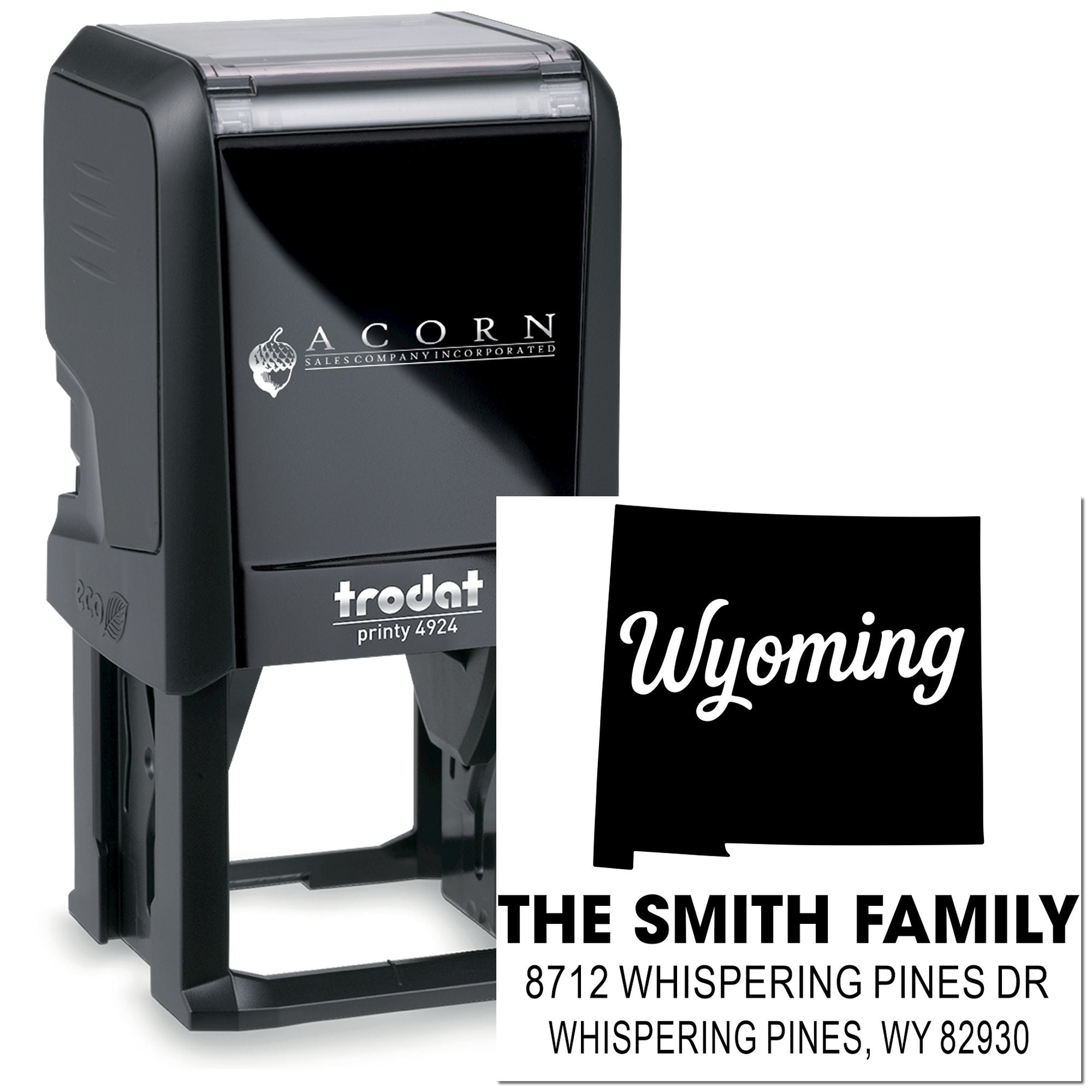 Custom self-inking Trodat address stamp with Wyoming state design, featuring The Smith Family name and Whispering Pines, WY address on white background.