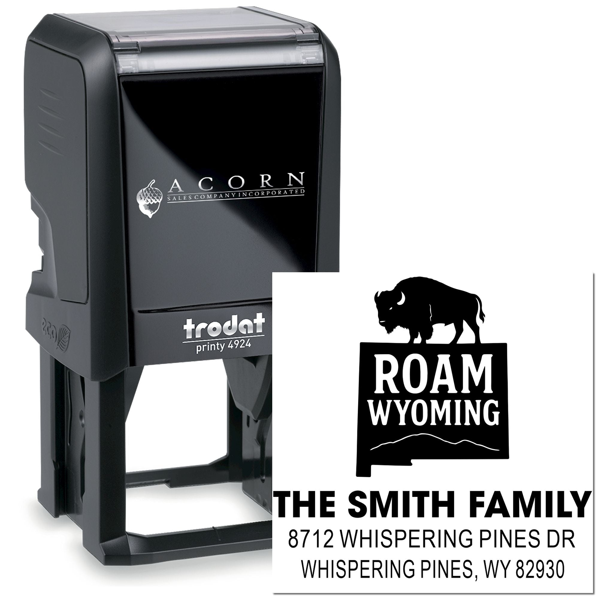Custom self-inking Trodat address stamp with bison ROAM WYOMING design and Smith family address on white background.