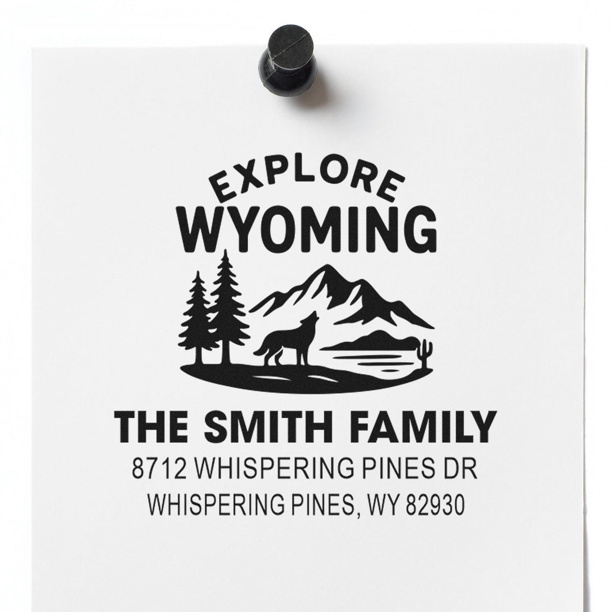 Custom address stamp for The Smith Family, featuring an Explore Wyoming mountain, pine tree, wolf design and Wyoming mailing address.