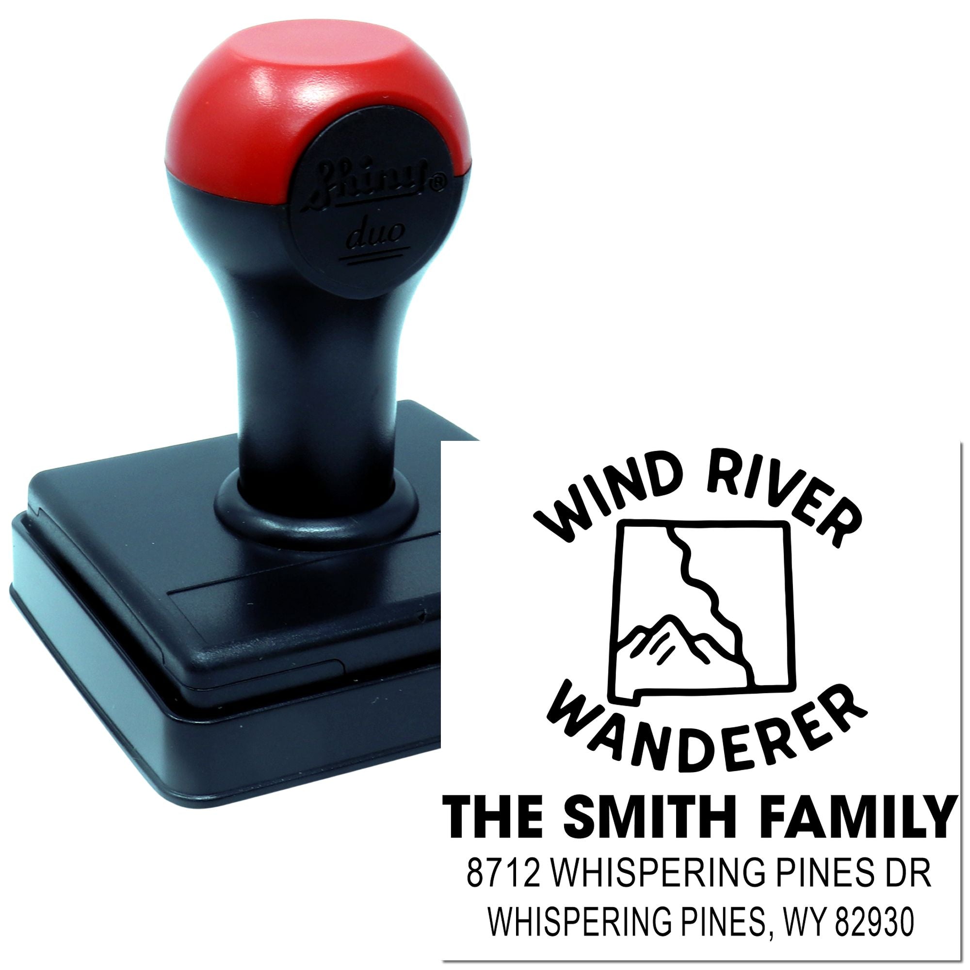 Custom self-inking Wind River Wanderer address stamp with red and black handle beside sample imprint for The Smith Family in Whispering Pines, WY.