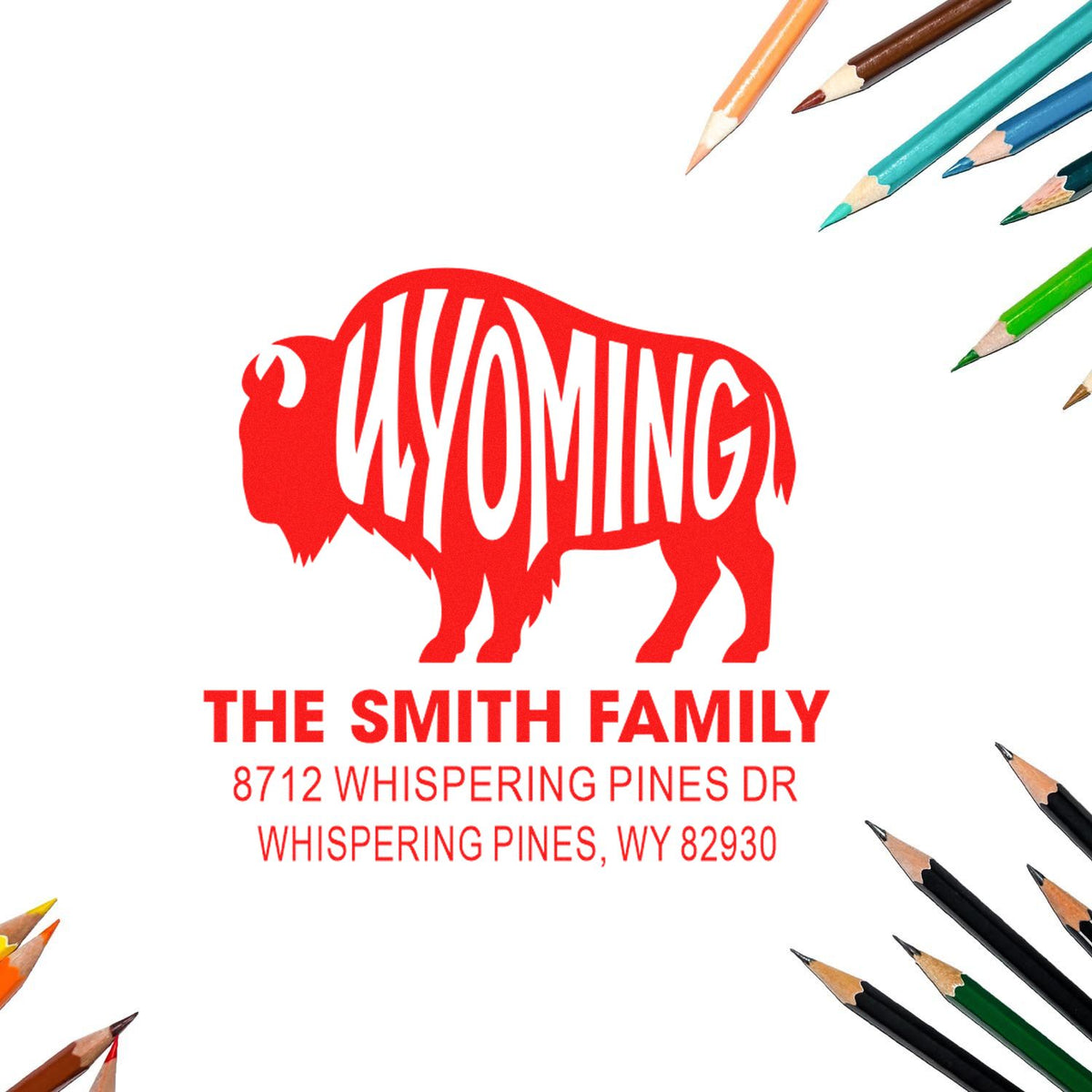 Custom Wyoming buffalo address stamp for The Smith Family, with red bison and Whispering Pines, WY address on a white background, framed by colored pencils.