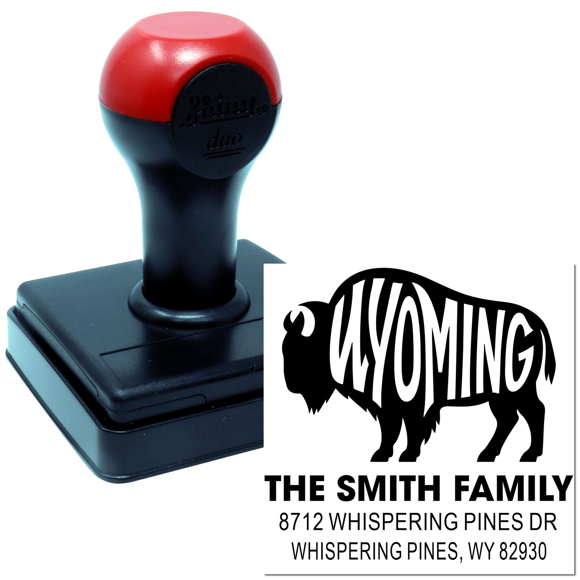 Custom personalized self-inking stamp with red-and-black handle, Wyoming buffalo design, family name, and address imprint on white background.