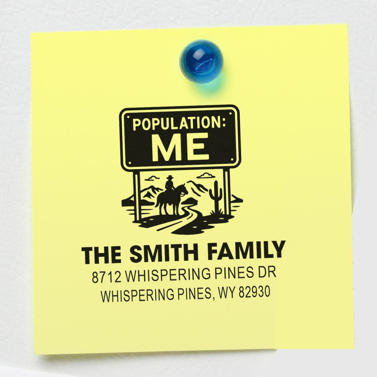 Custom family address stamp on yellow note with blue magnet, featuring Population: Me western design and The Smith Family address.