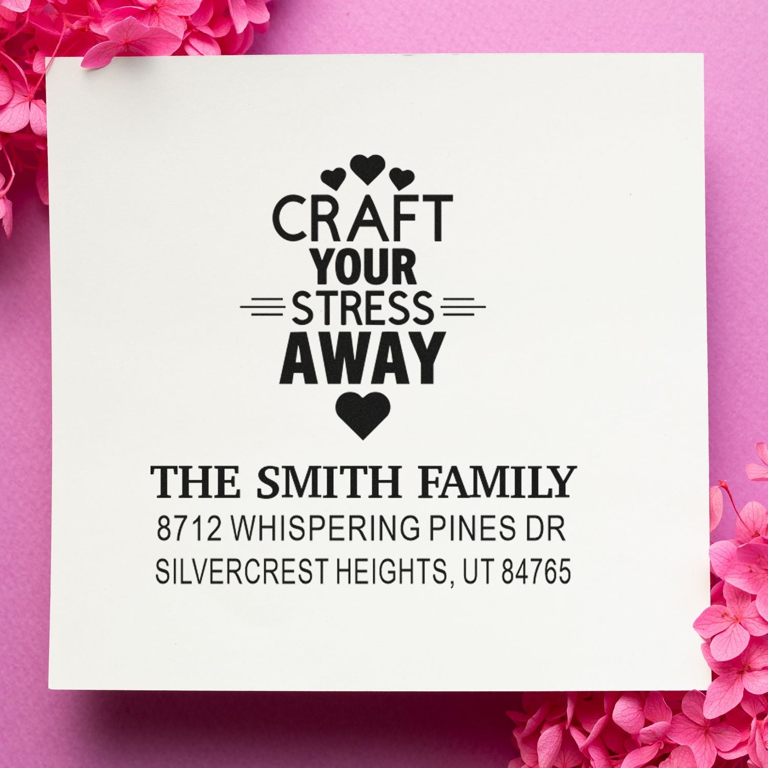 Personalized address stamp with Craft Your Stress Away design, The Smith Family name and Utah address on white card with pink flowers.