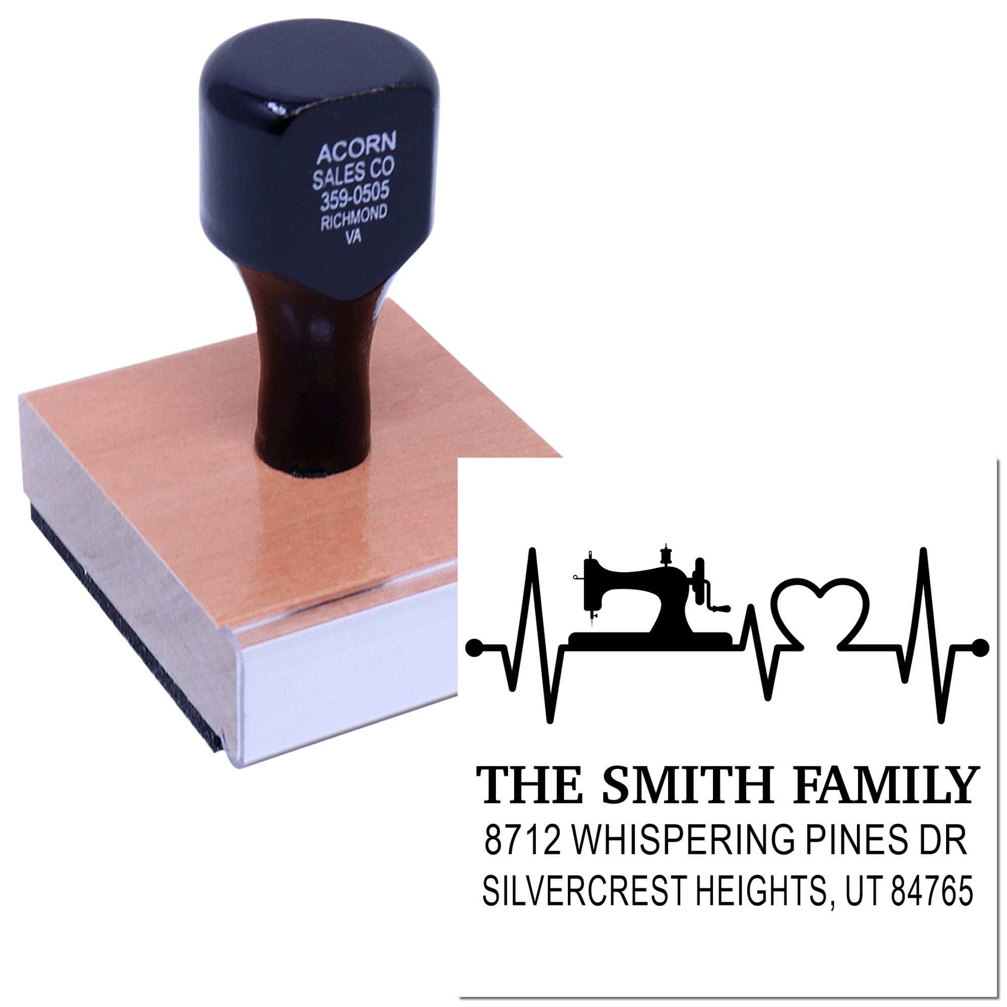 Custom self-inking address stamp with family name, sewing machine and heartbeat design, shown on a wooden base with sample imprint on white background.