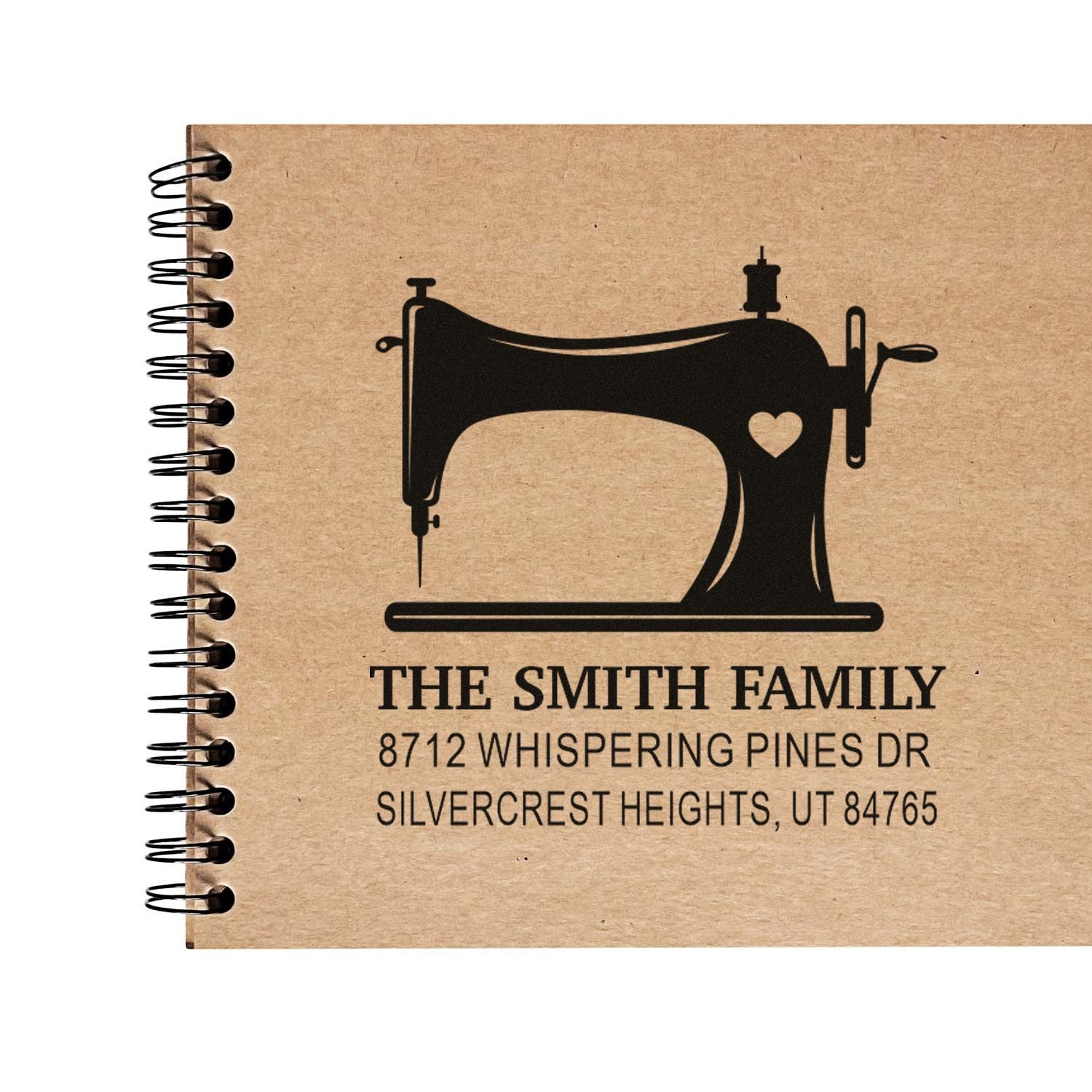Custom family address stamp with vintage sewing machine and heart design on kraft paper notebook cover, reading The Smith Family address.