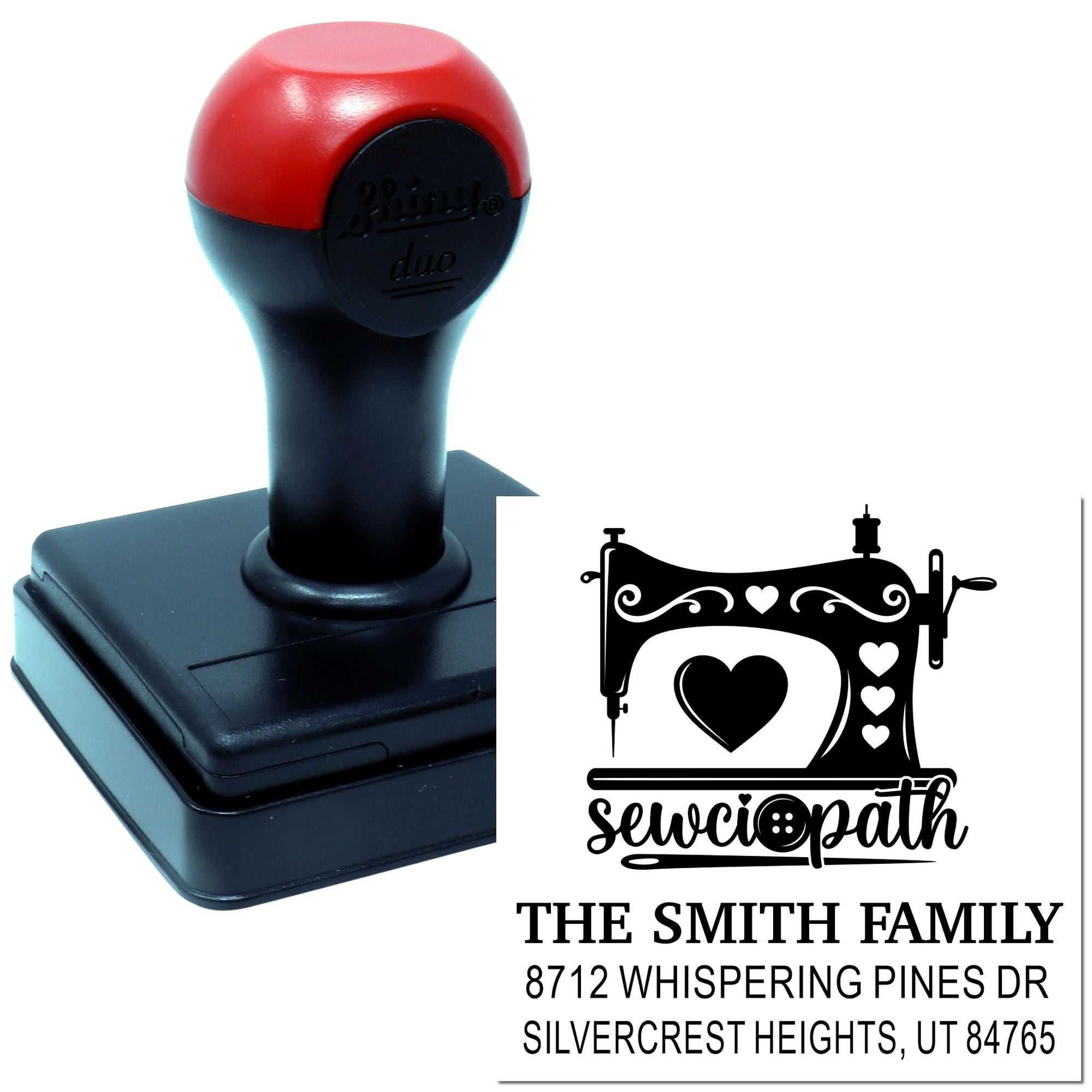Custom self-inking sewing machine stamp with hearts and sewciopath design, shown beside a personalized family address imprint on a white background.