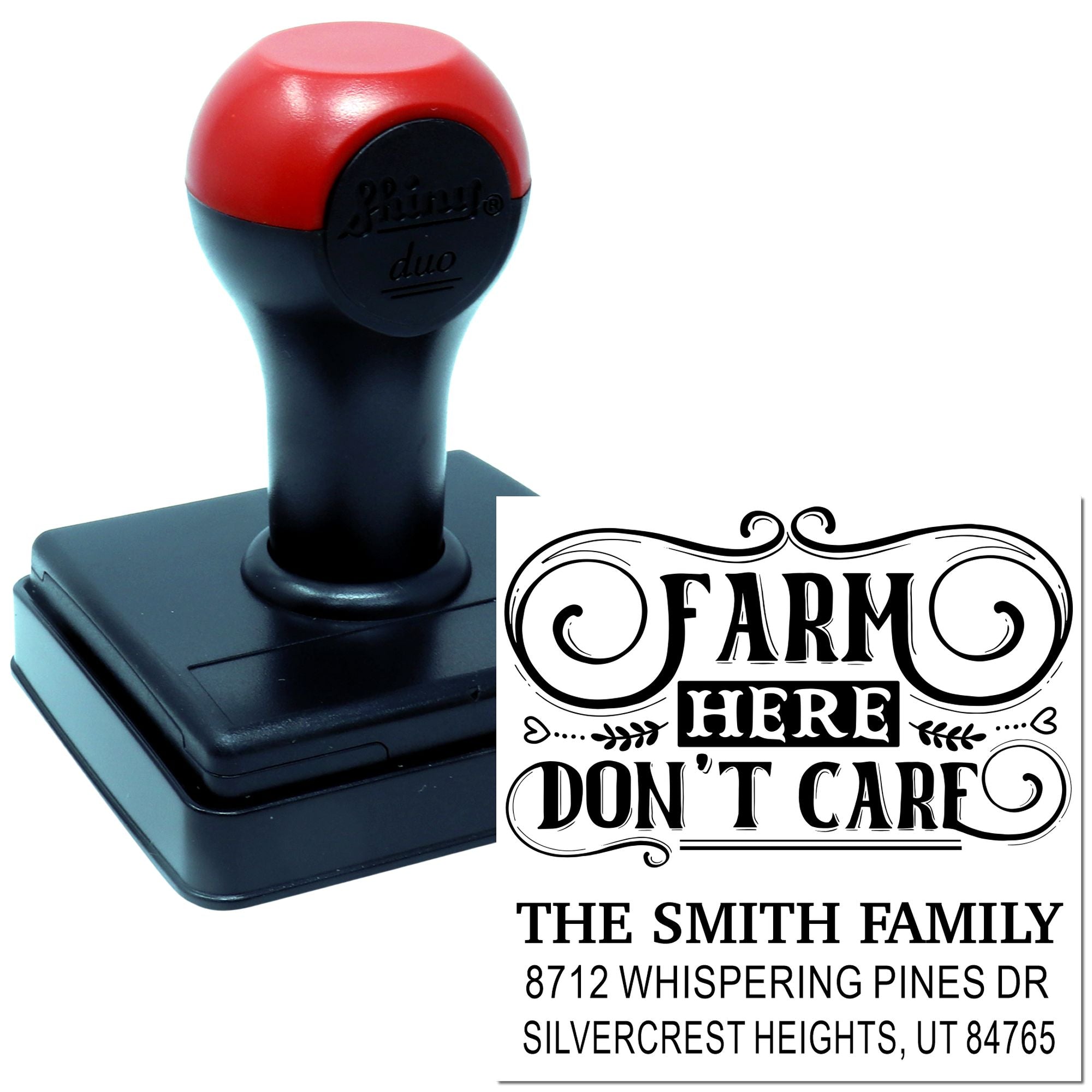 Personalized self-inking stamp with red and black handle, displaying a farm-themed address imprint on a white background.