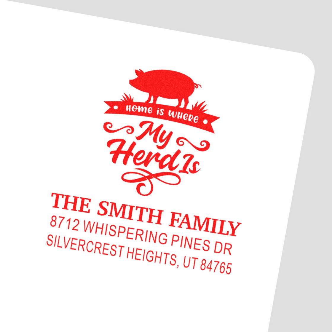 Custom red pig address stamp with "Home is where my herd is" for The Smith Family, 8712 Whispering Pines Dr, Silvercrest Heights, UT 84765.