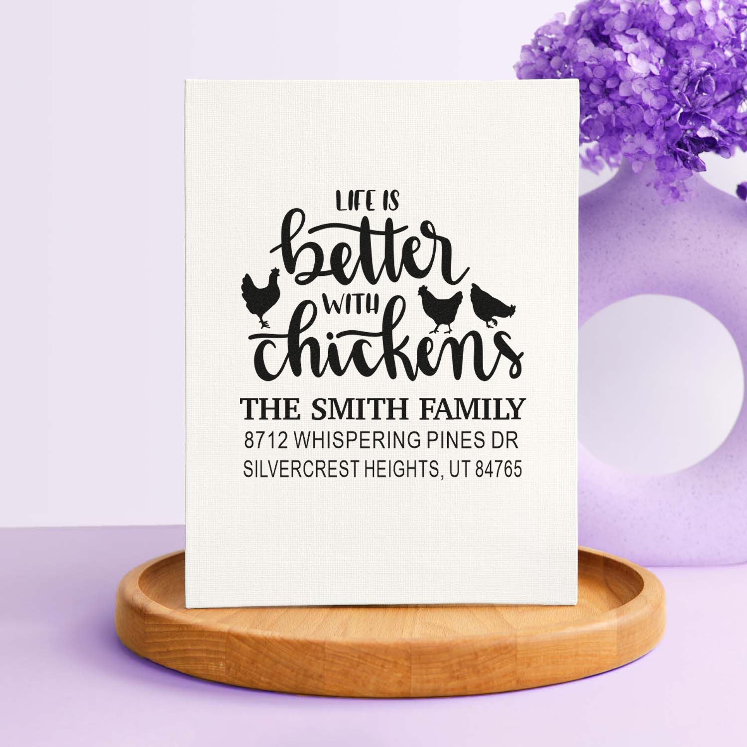 Custom chicken-themed address stamp with Life is better with chickens, Smith family address, displayed on a wooden tray with purple decor.
