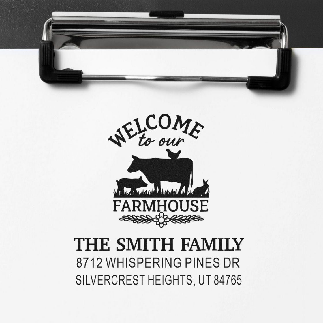 Personalized farmhouse address stamp on white paper with cow silhouettes, reading Welcome to our Farmhouse and The Smith Family, Silvercrest Heights, UT.