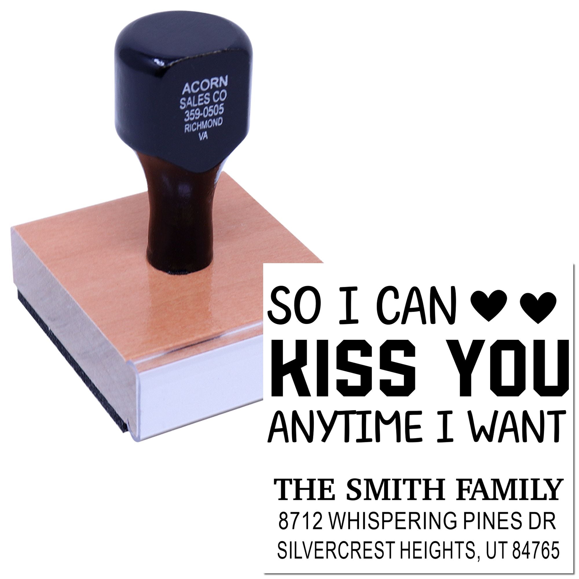 Custom wood handle rubber stamp with So I Can Kiss You Anytime I Want text, hearts, and family address imprint on a white background.