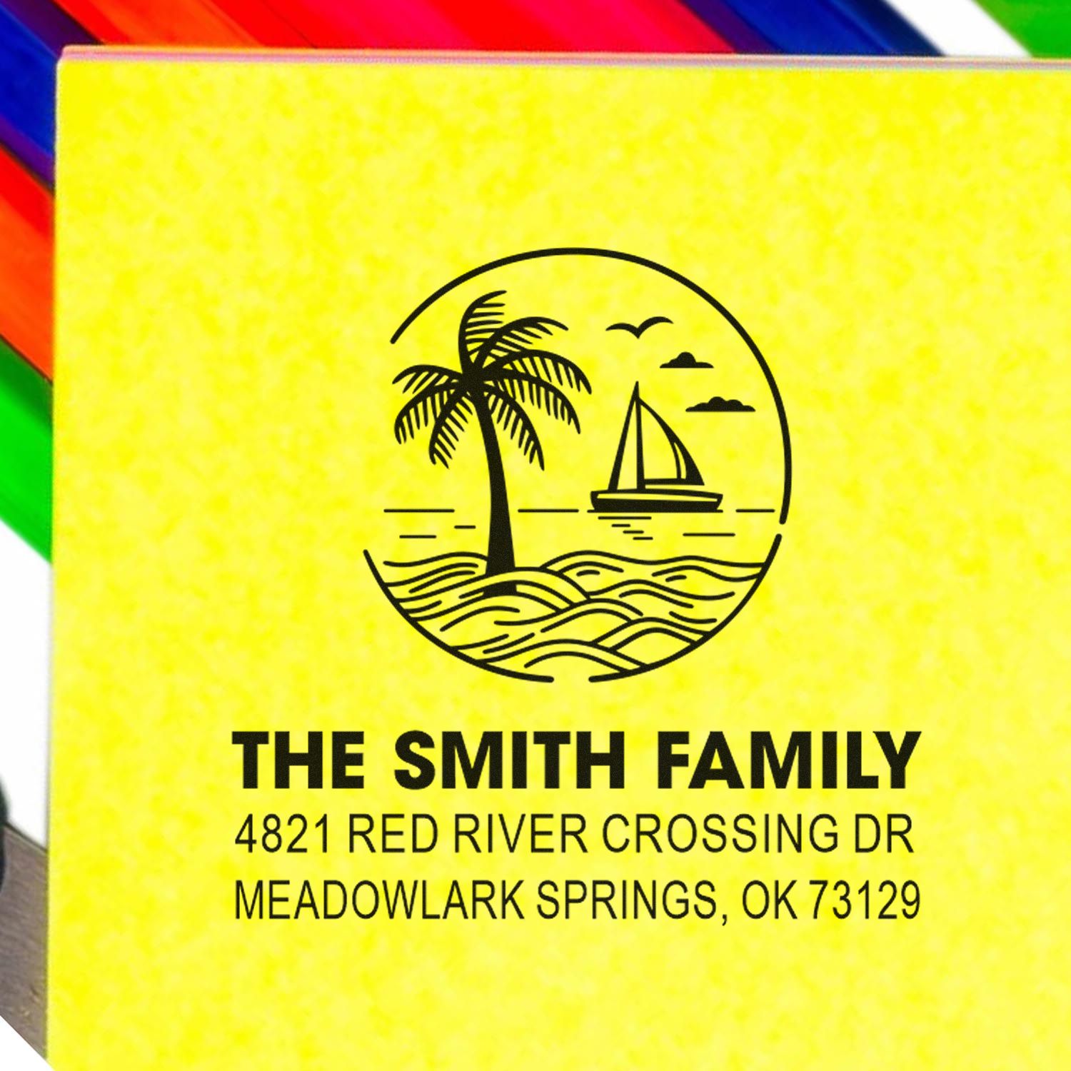 Personalized address stamp with palm tree and sailboat beach logo, reading The Smith Family, Meadowlark Springs, OK on a yellow background.