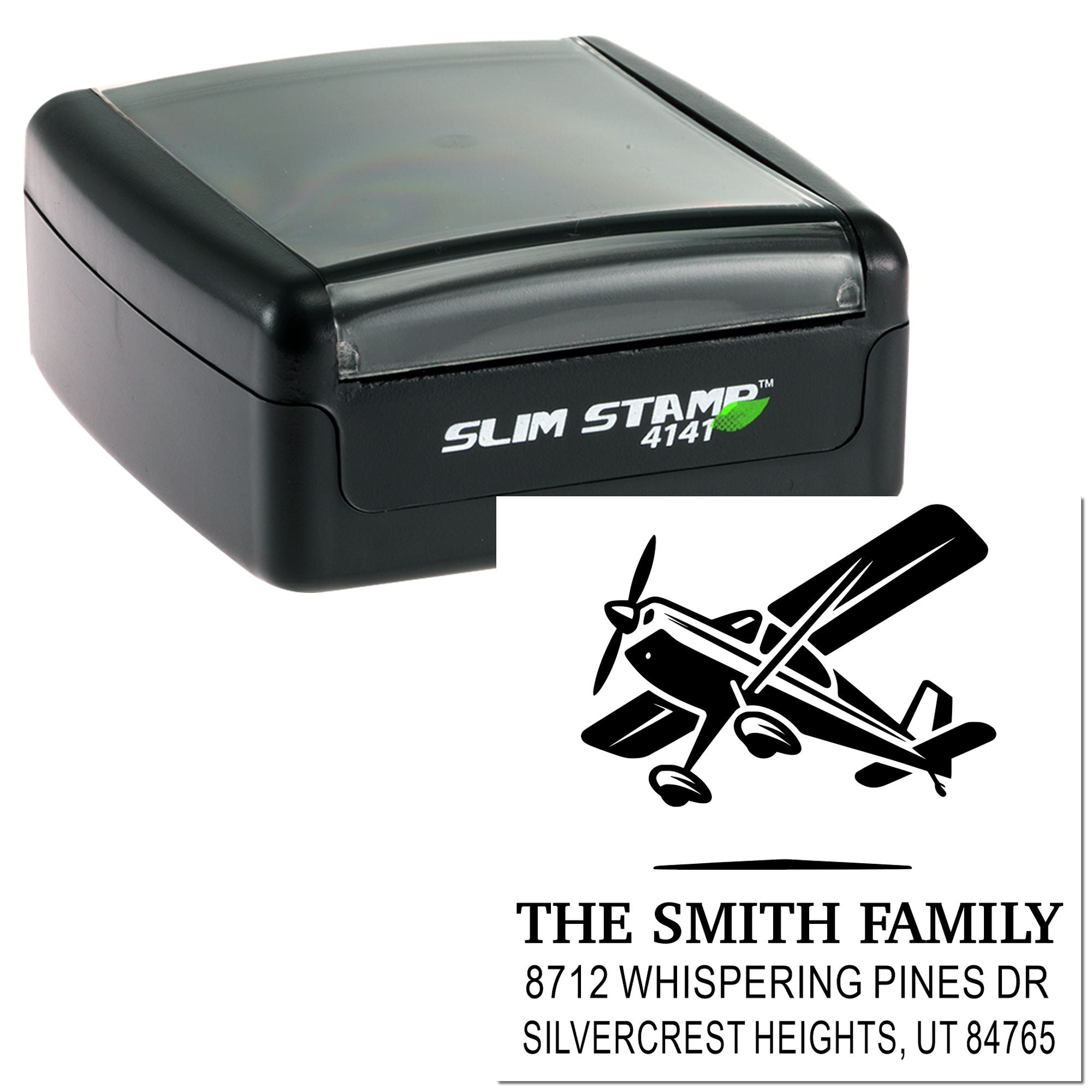 Custom Slim Stamp 4141 with airplane logo and family address, black self-inking stamp on white background