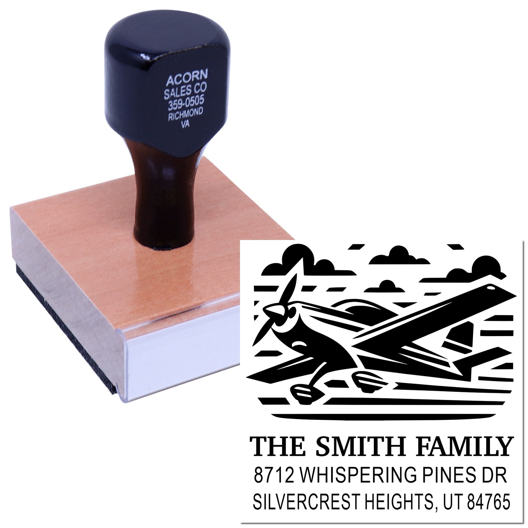 Custom self-inking address stamp with airplane graphic, family name, and Silvercrest Heights, UT return address on a white background.