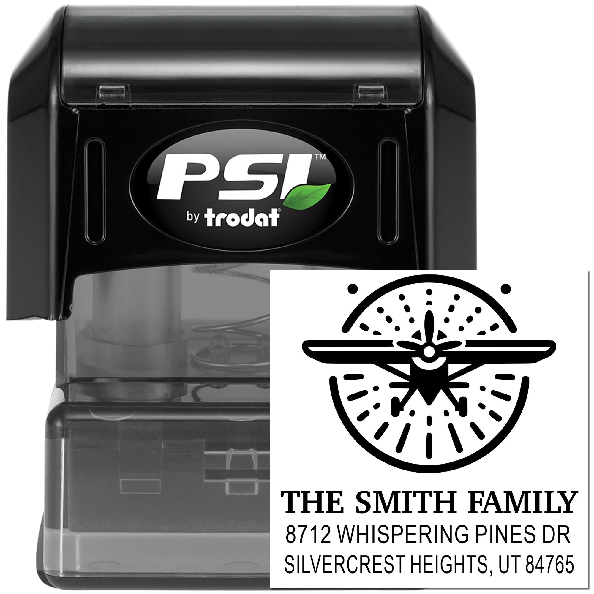 Black PSI by Trodat self-inking personalized return address stamp with airplane logo and The Smith Family address on a white background.