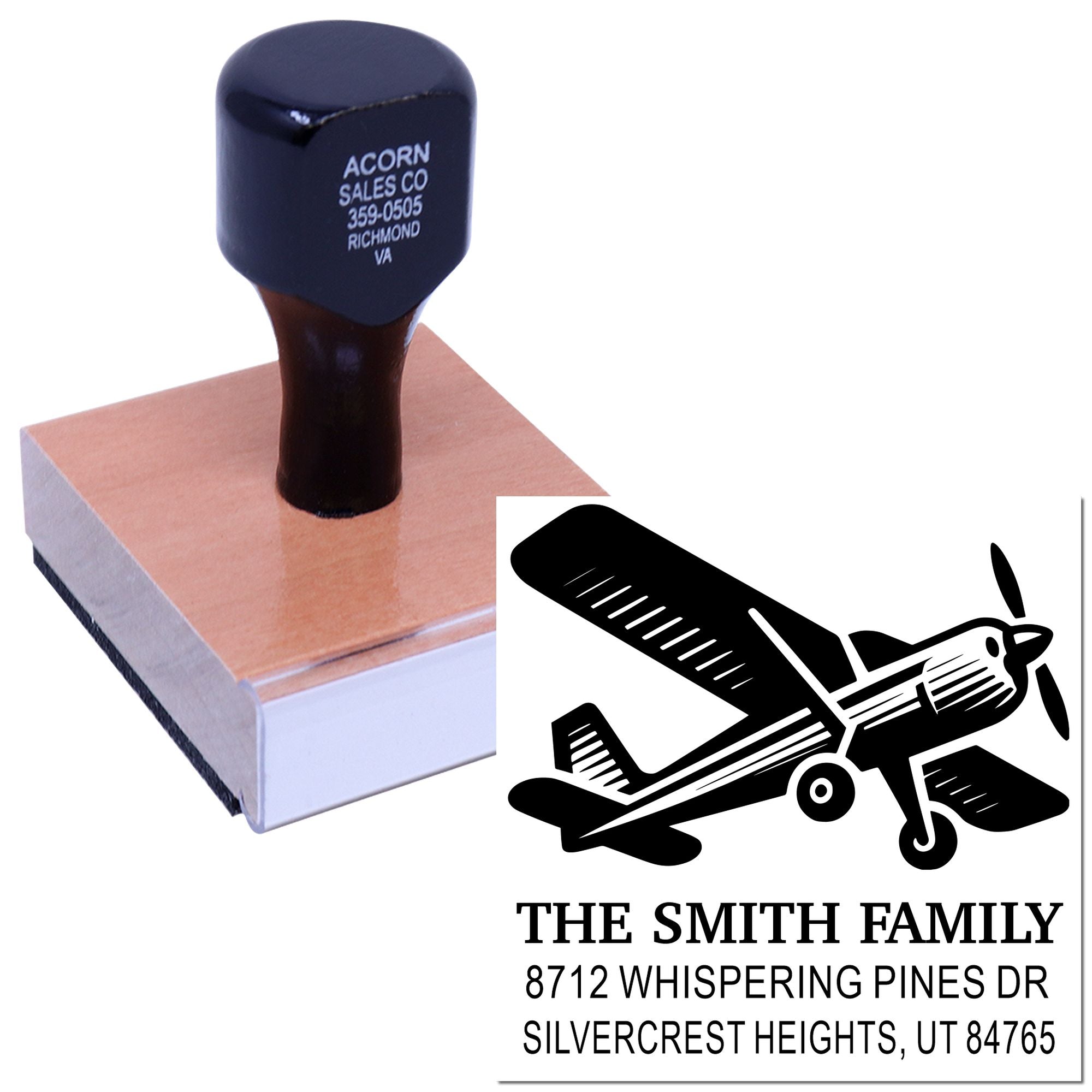 Personalized self-inking stamp and imprint design with airplane logo, custom family name and address on a white background.