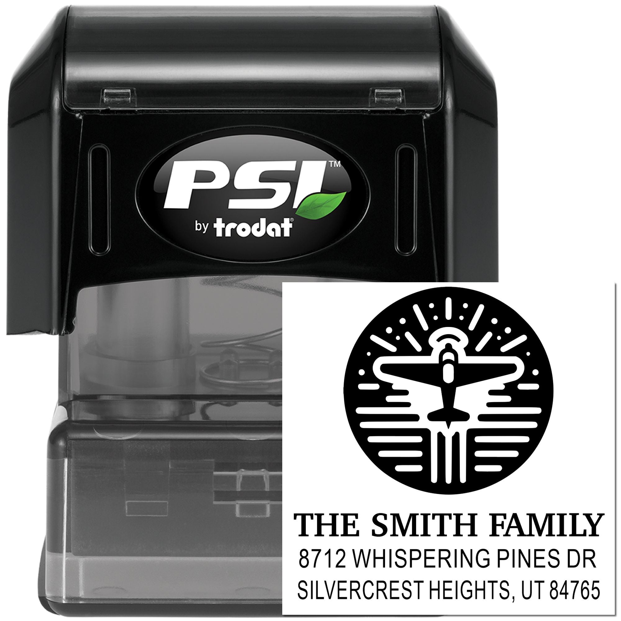 Black PSI by Trodat self-inking custom address stamp with airplane logo and The Smith Family return address on white background.