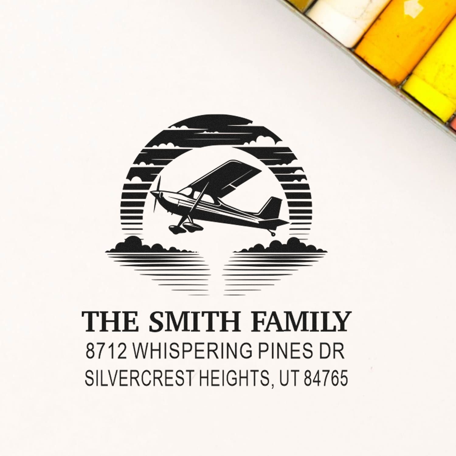 Custom return address stamp with airplane silhouette for The Smith Family, featuring Whispering Pines Dr, Silvercrest Heights, UT 84765.
